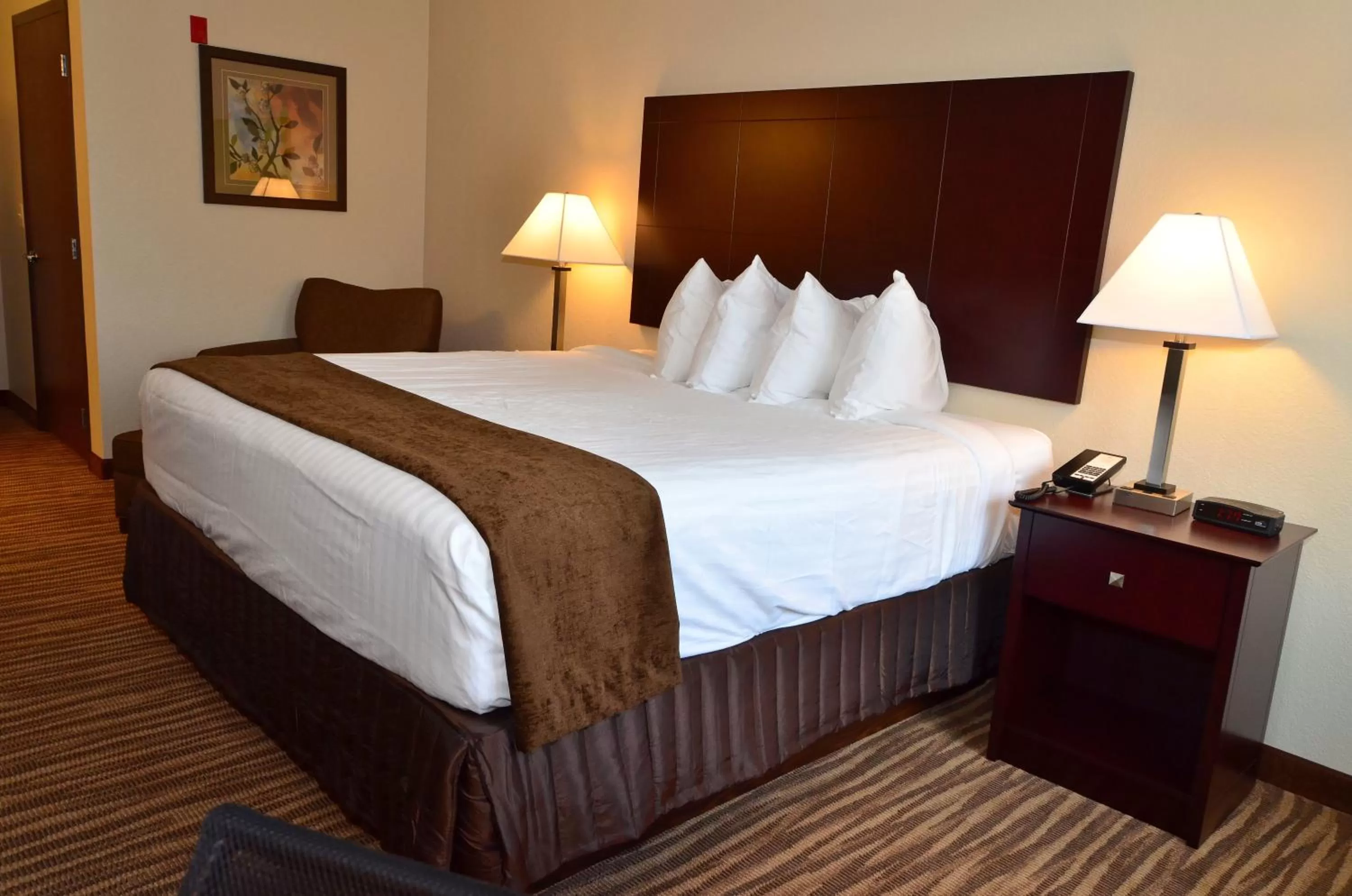 Bed in Cobblestone Inn & Suites - Clarion