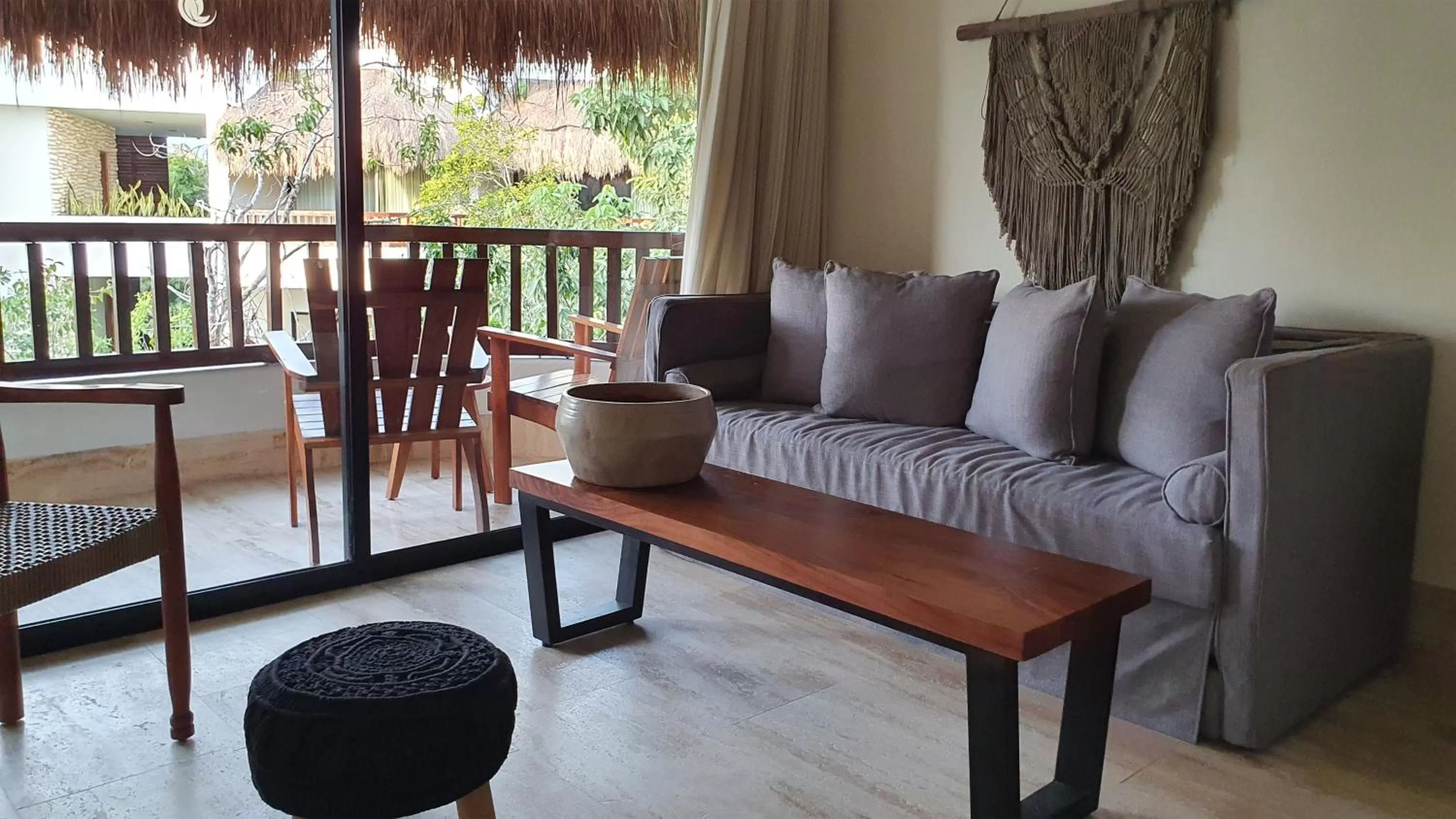 Living room in Kimpton Aluna Resort Tulum by IHG