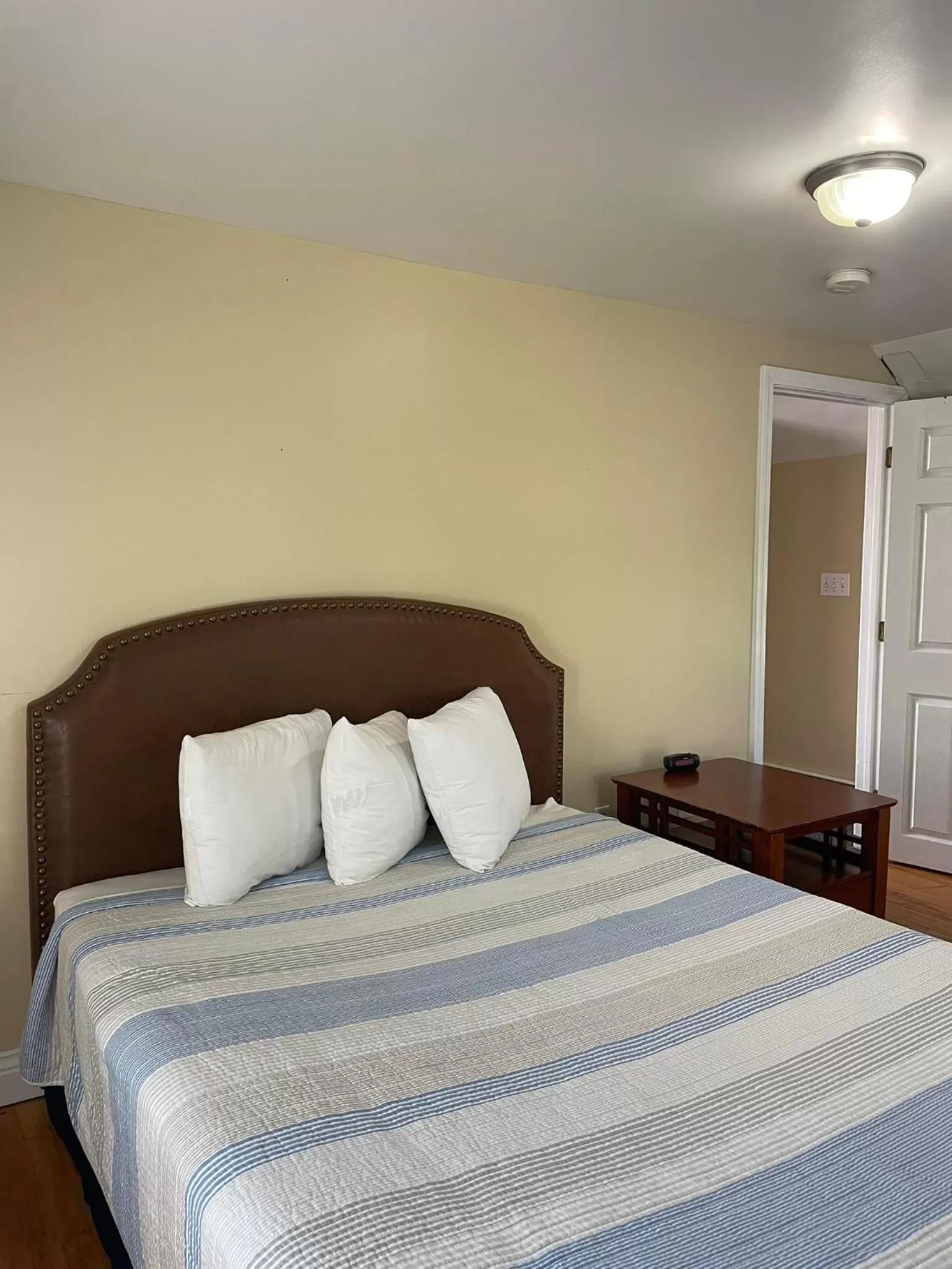 Bed in The Grand Beach Inn