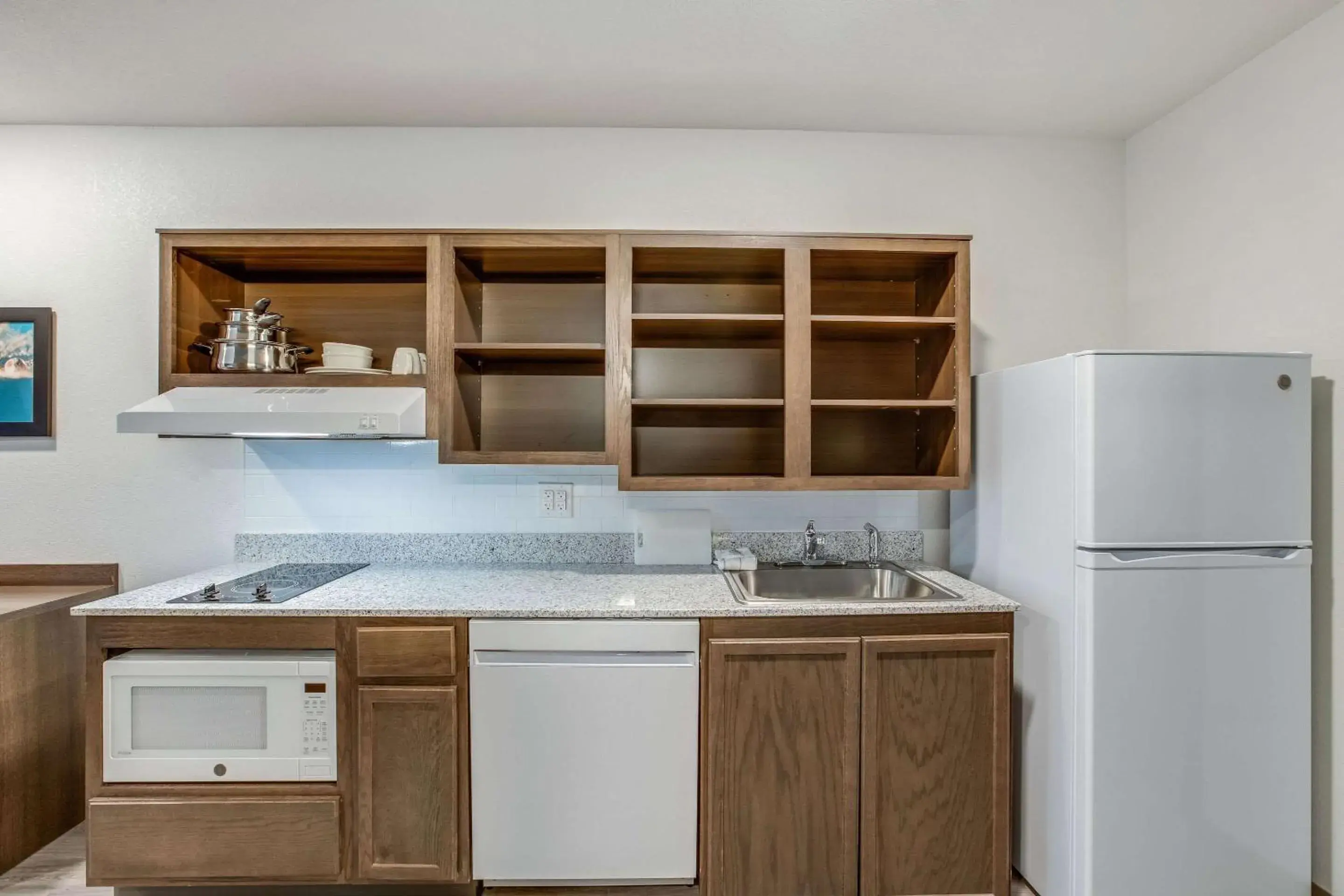 Photo of the whole room, Kitchen/Kitchenette in WoodSpring Suites Detroit Farmington Hills