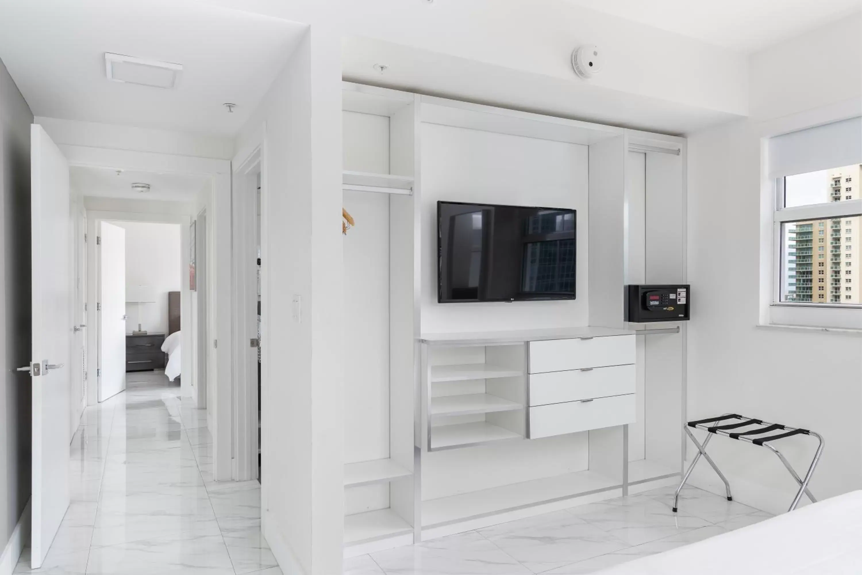 wardrobe, TV/Entertainment Center in Fortune House Hotel Suites