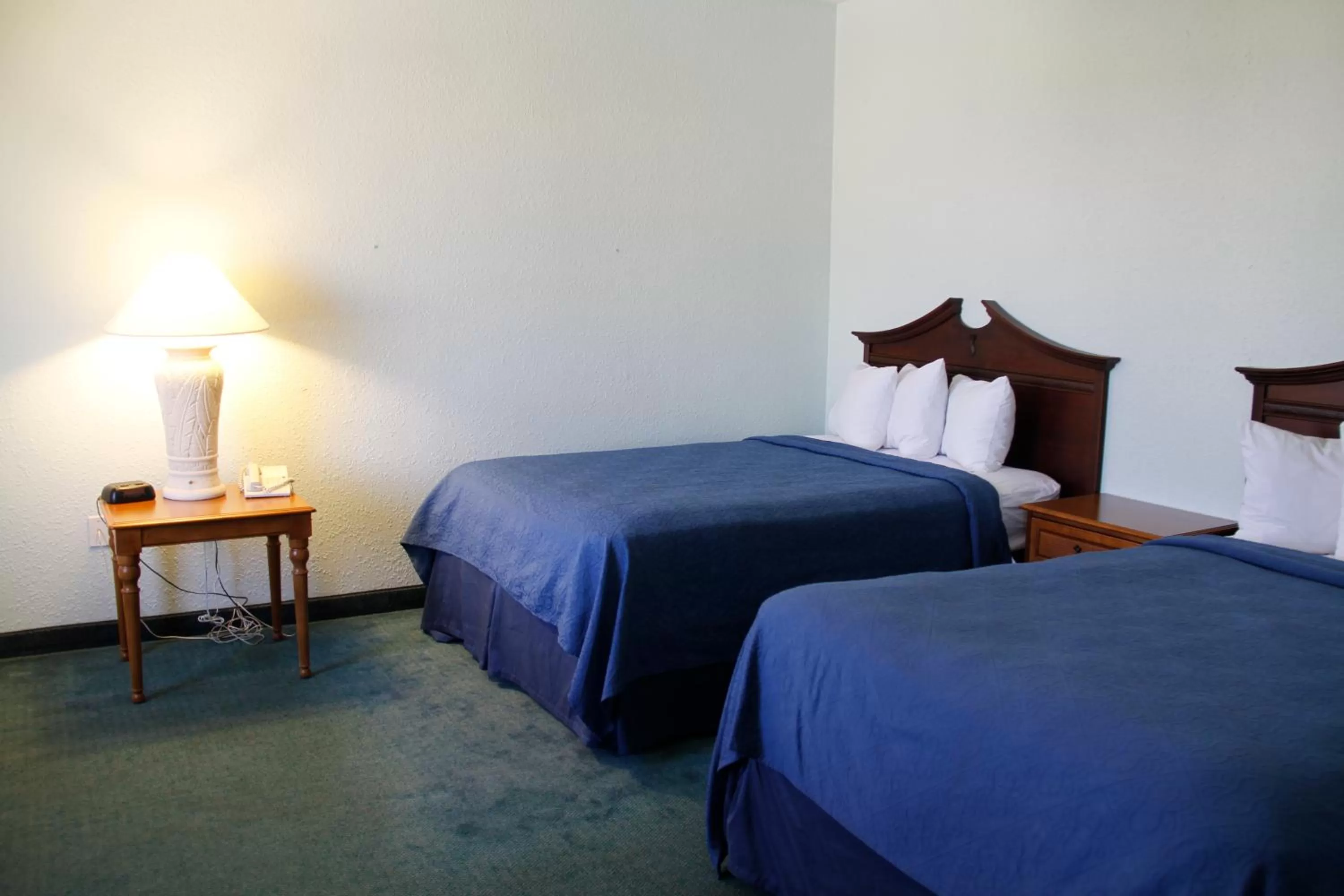 Bed in Cocoa Beach Suites Hotel