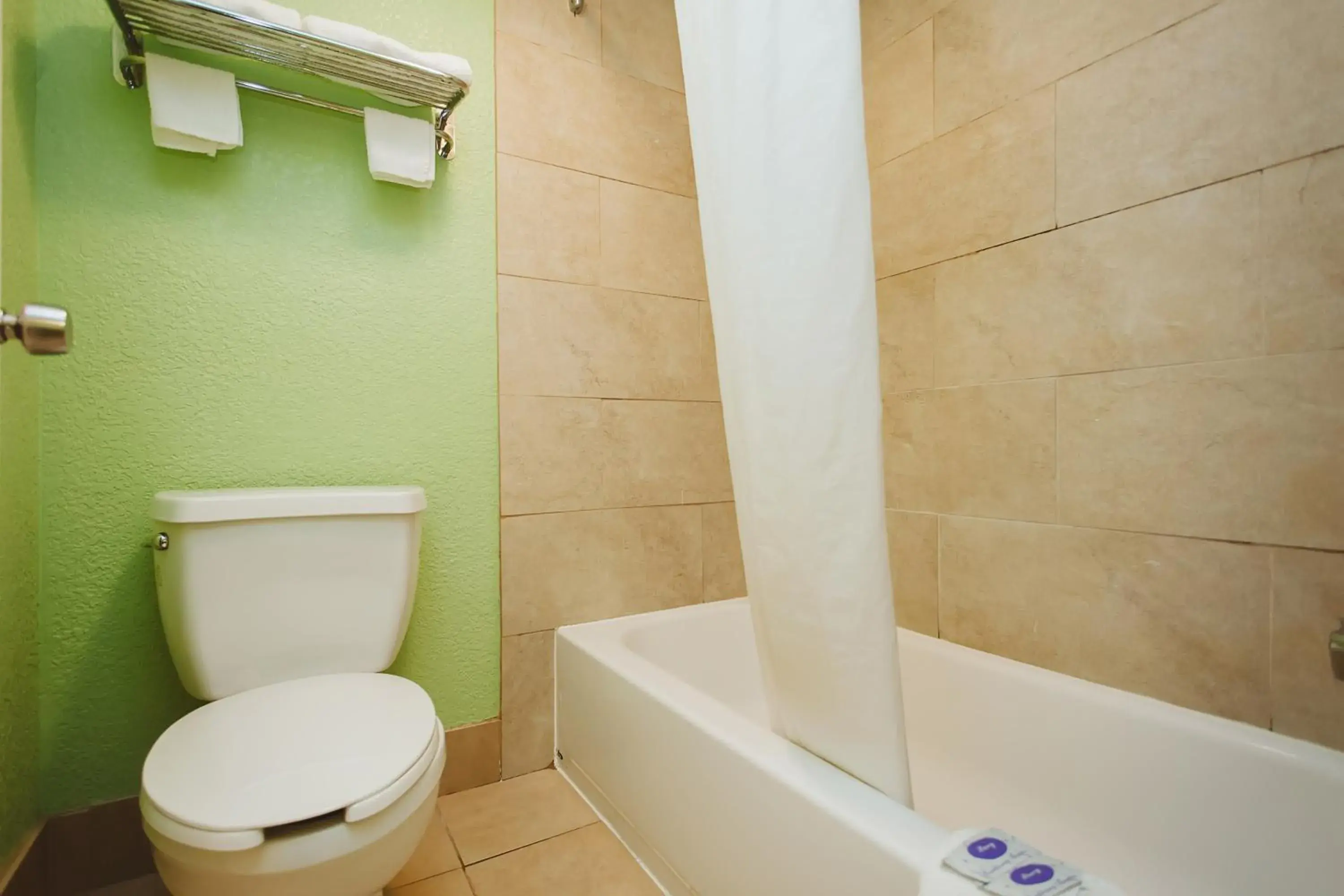 Property building, Bathroom in REGENCY INN - CHANNELVIEW