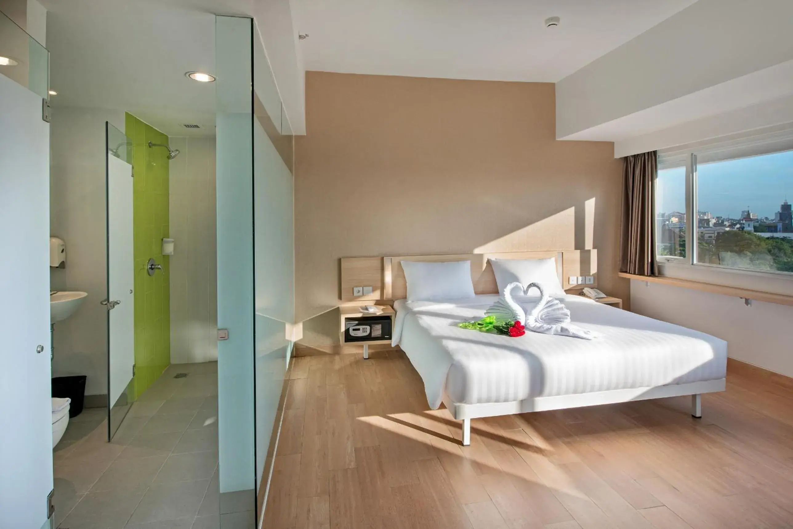 Shower, Bed in Whiz Prime Hotel Hasanuddin Makassar