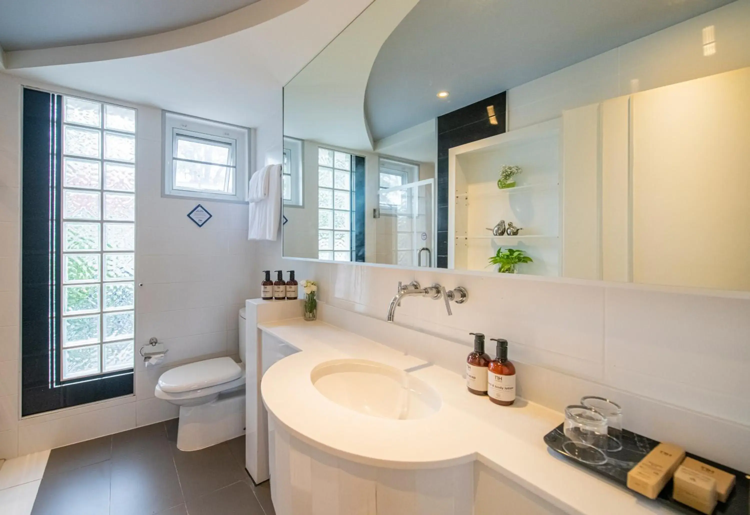 Bathroom in NH Boat Lagoon Phuket Resort Bathroom in NH Boat Lagoon Phuket Resort