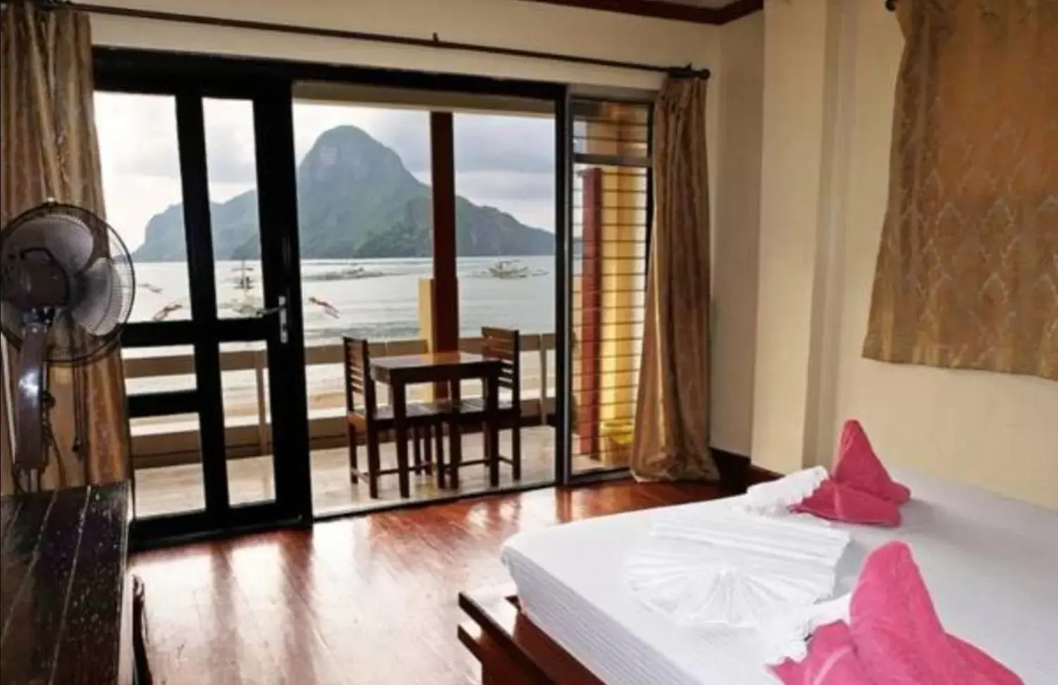 Balcony/Terrace, Bed in El Nido Beach Hotel Balcony/Terrace, Bed in El Nido Beach Hotel