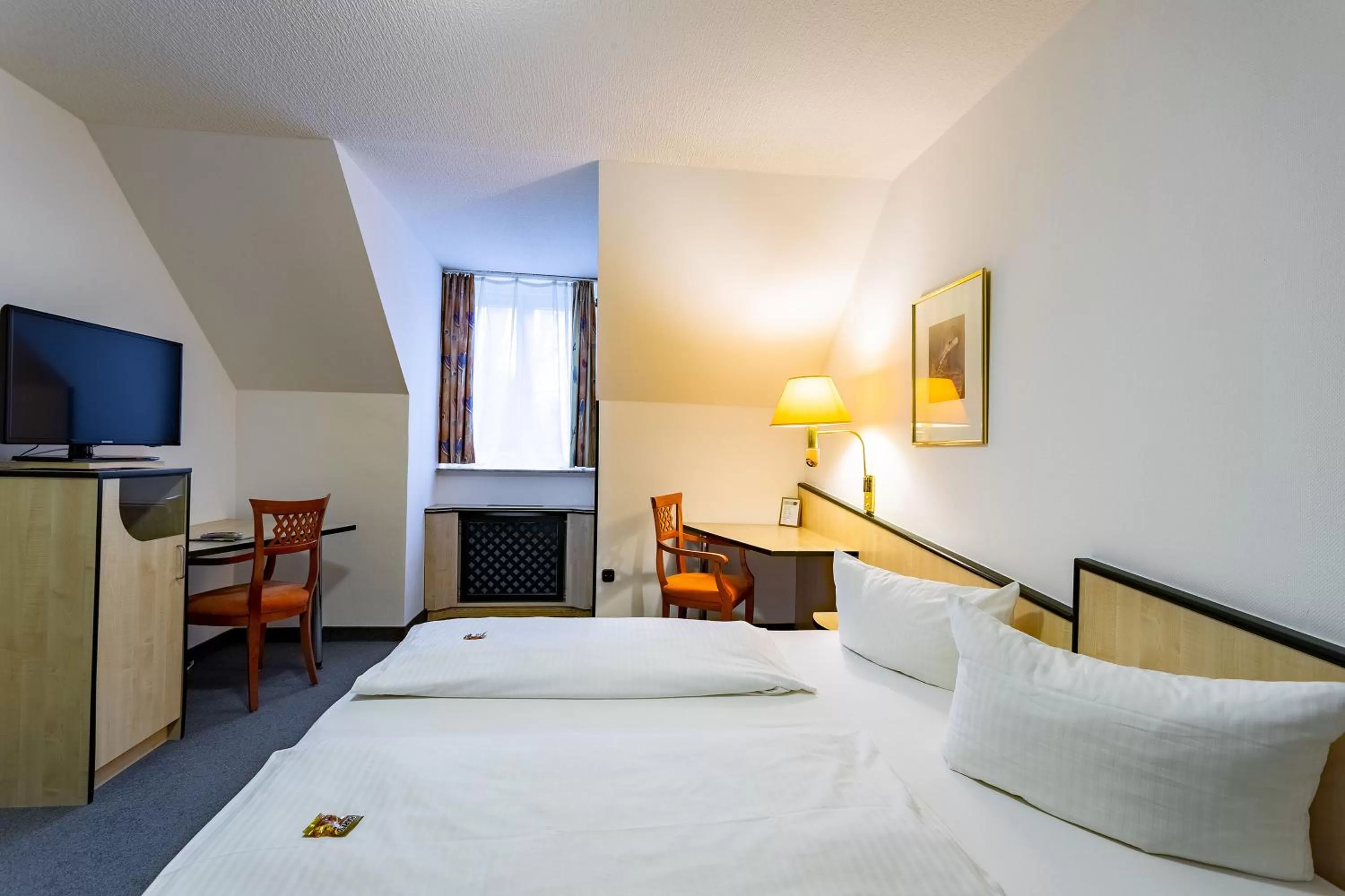 Photo of the whole room, Bed in Waldhotel Eskeshof