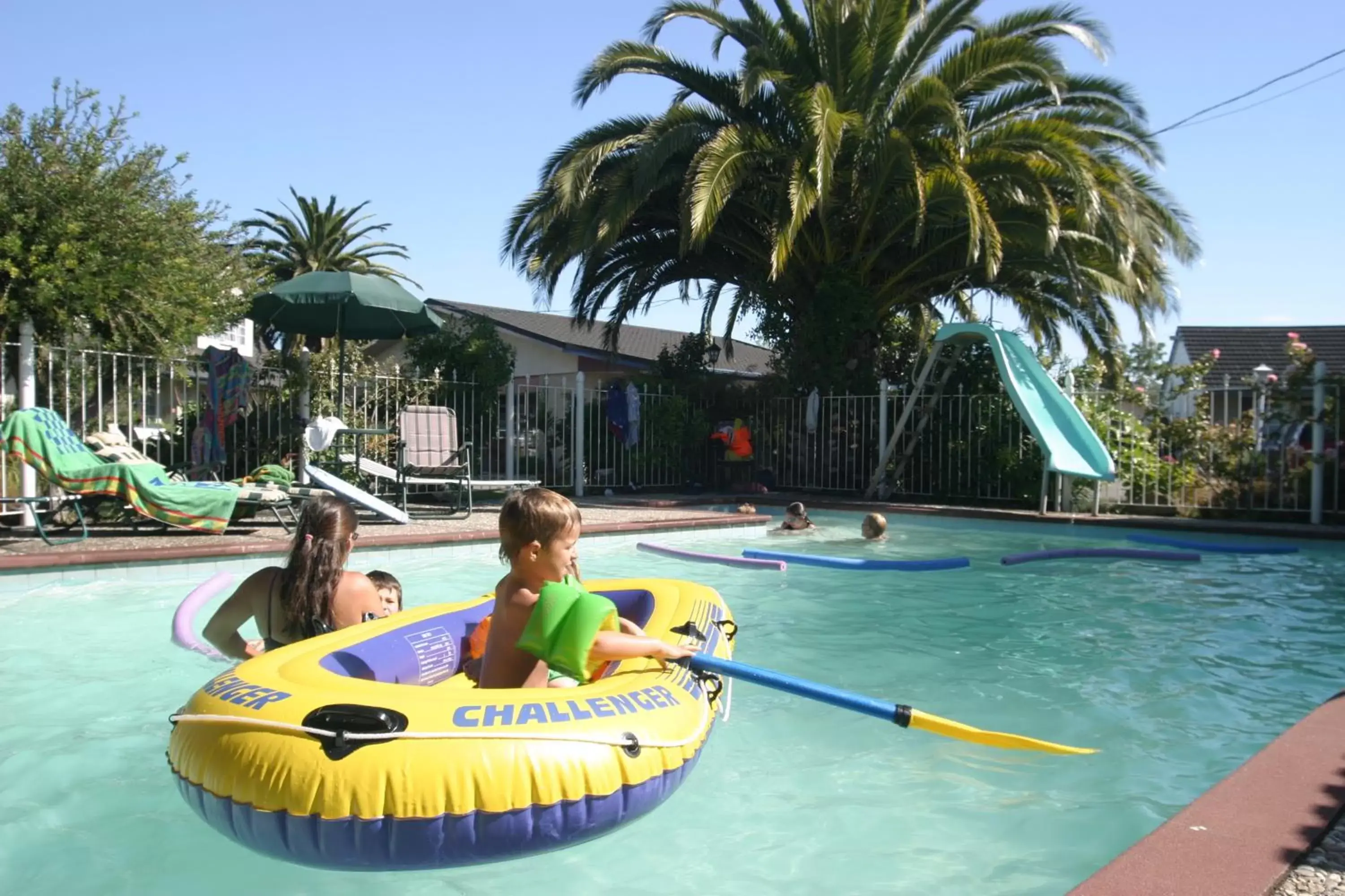 Swimming pool, Water Park in ASURE Colonial Lodge Motel