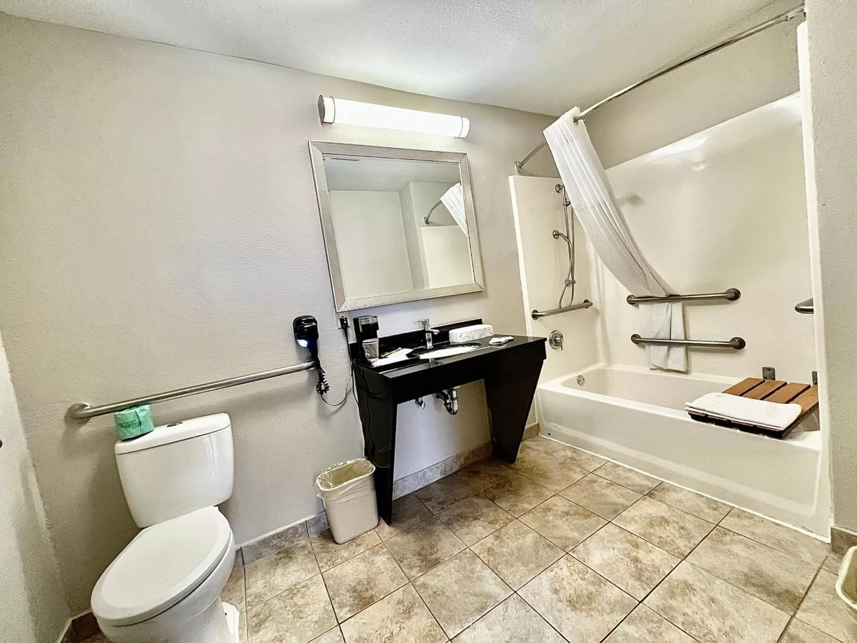 Bathroom in Days Inn & Suites by Wyndham Arlington Near Six Flags