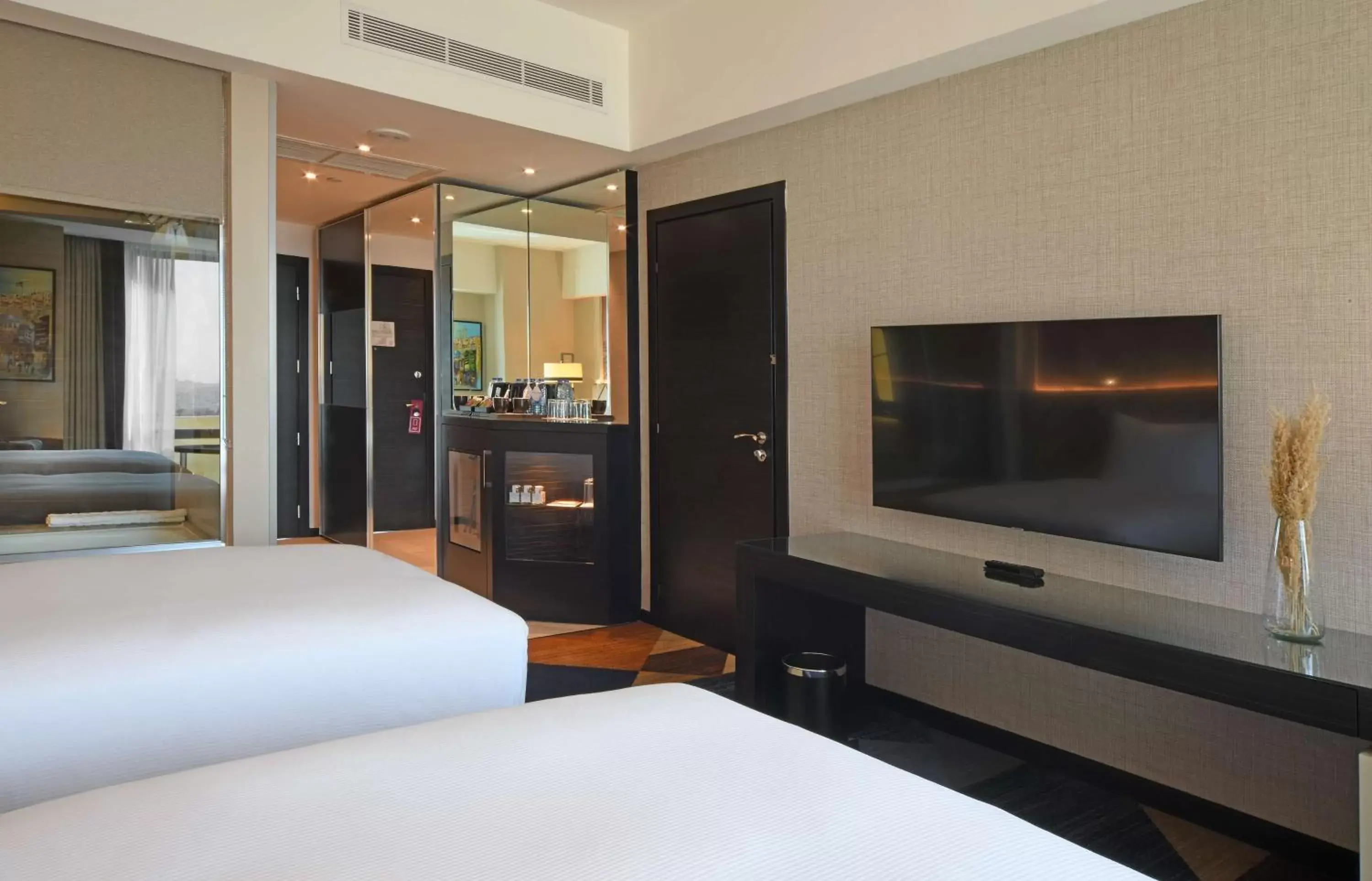 Bed, TV/Entertainment Center in Hilton Amman