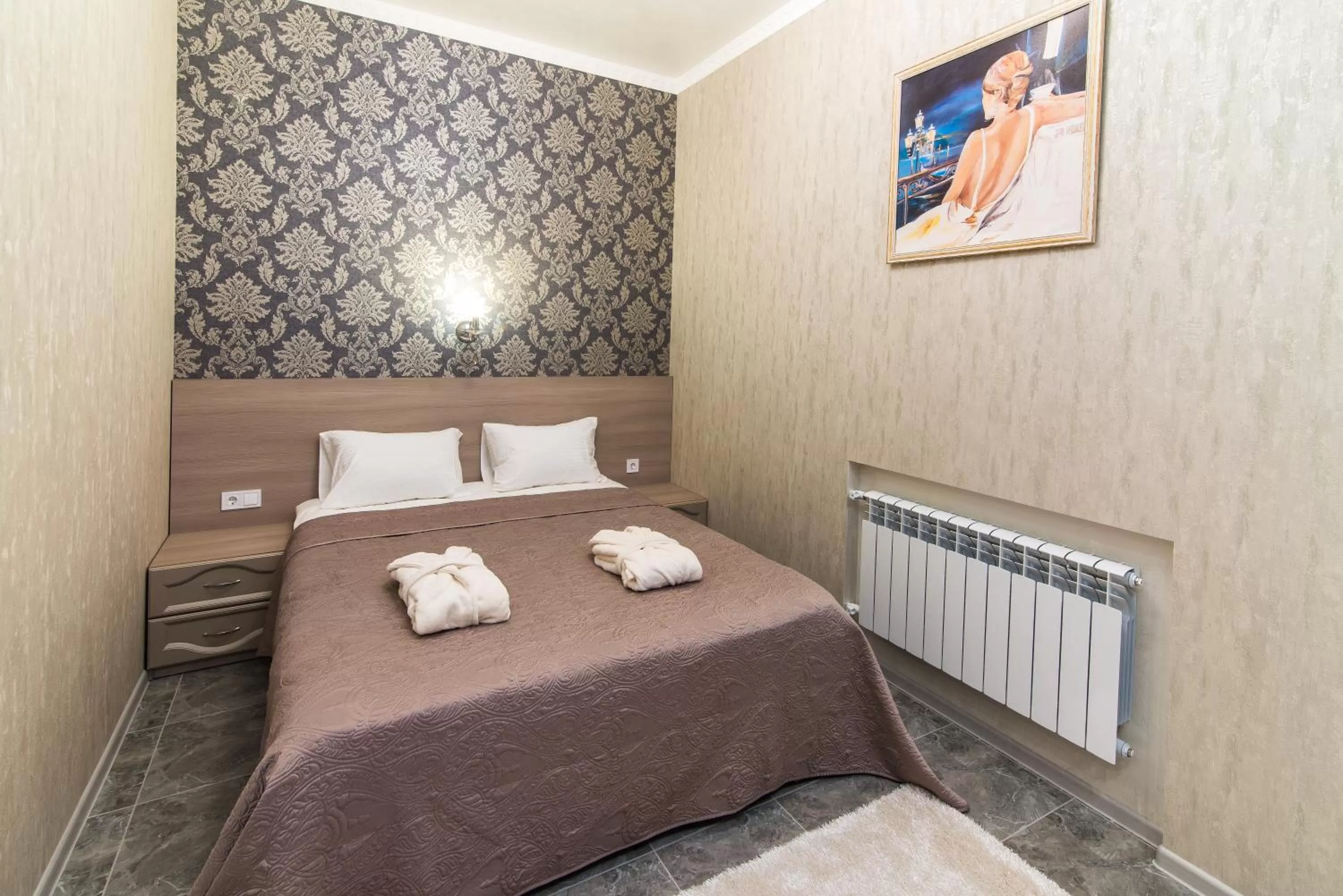 Bed in L.O.Y Family Hotel