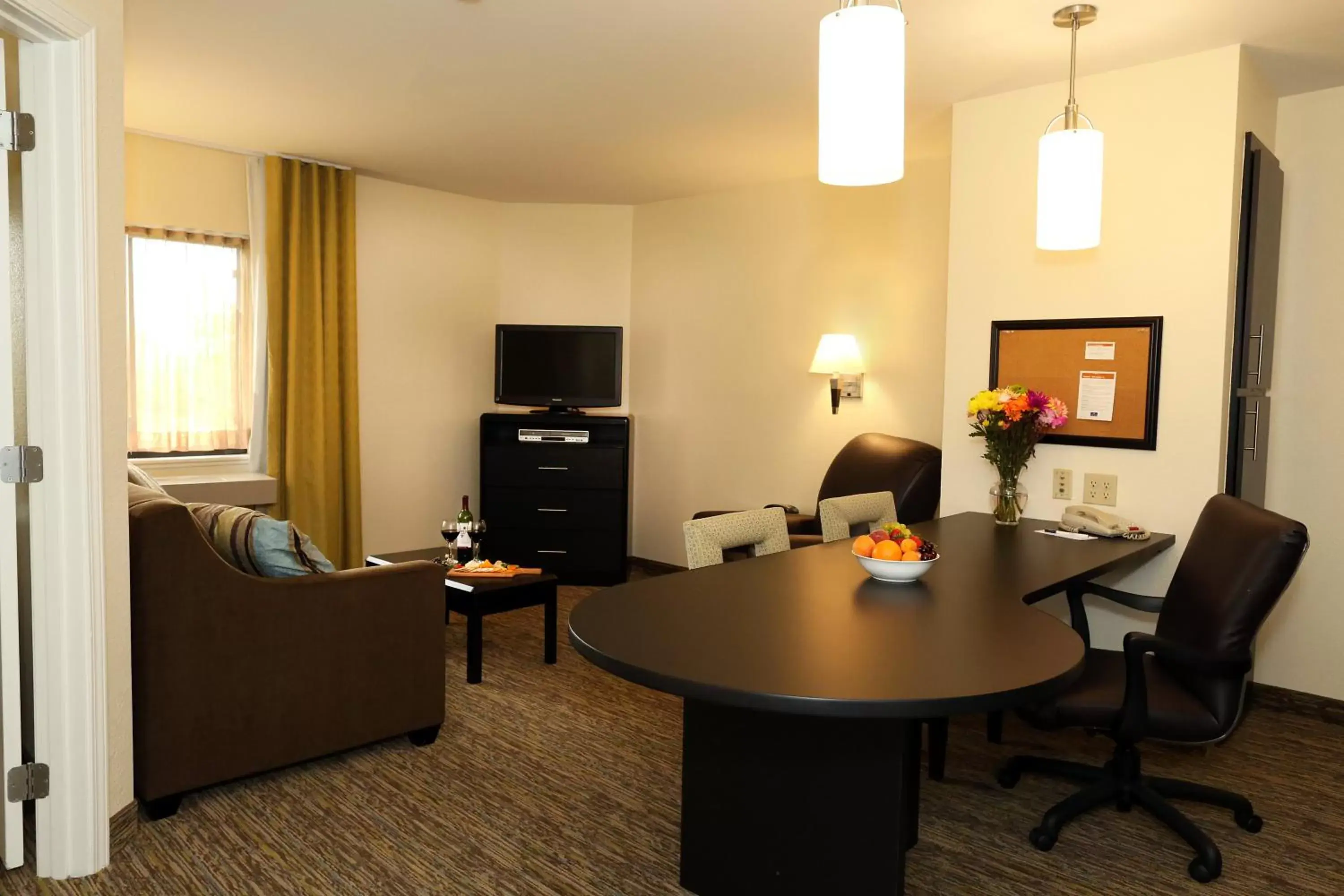 Photo of the whole room, TV/Entertainment Center in Candlewood Suites East Lansing, an IHG Hotel