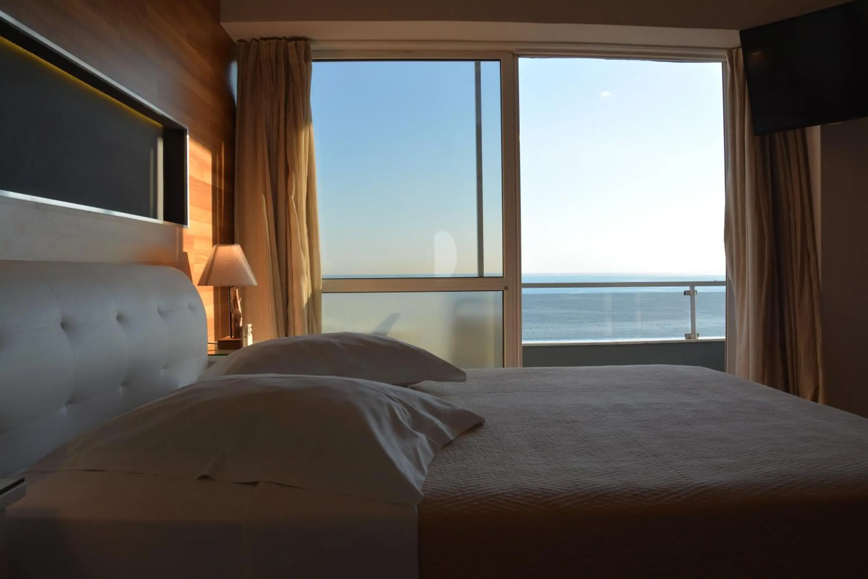 Bed in Scorpios Sea Side Hotel