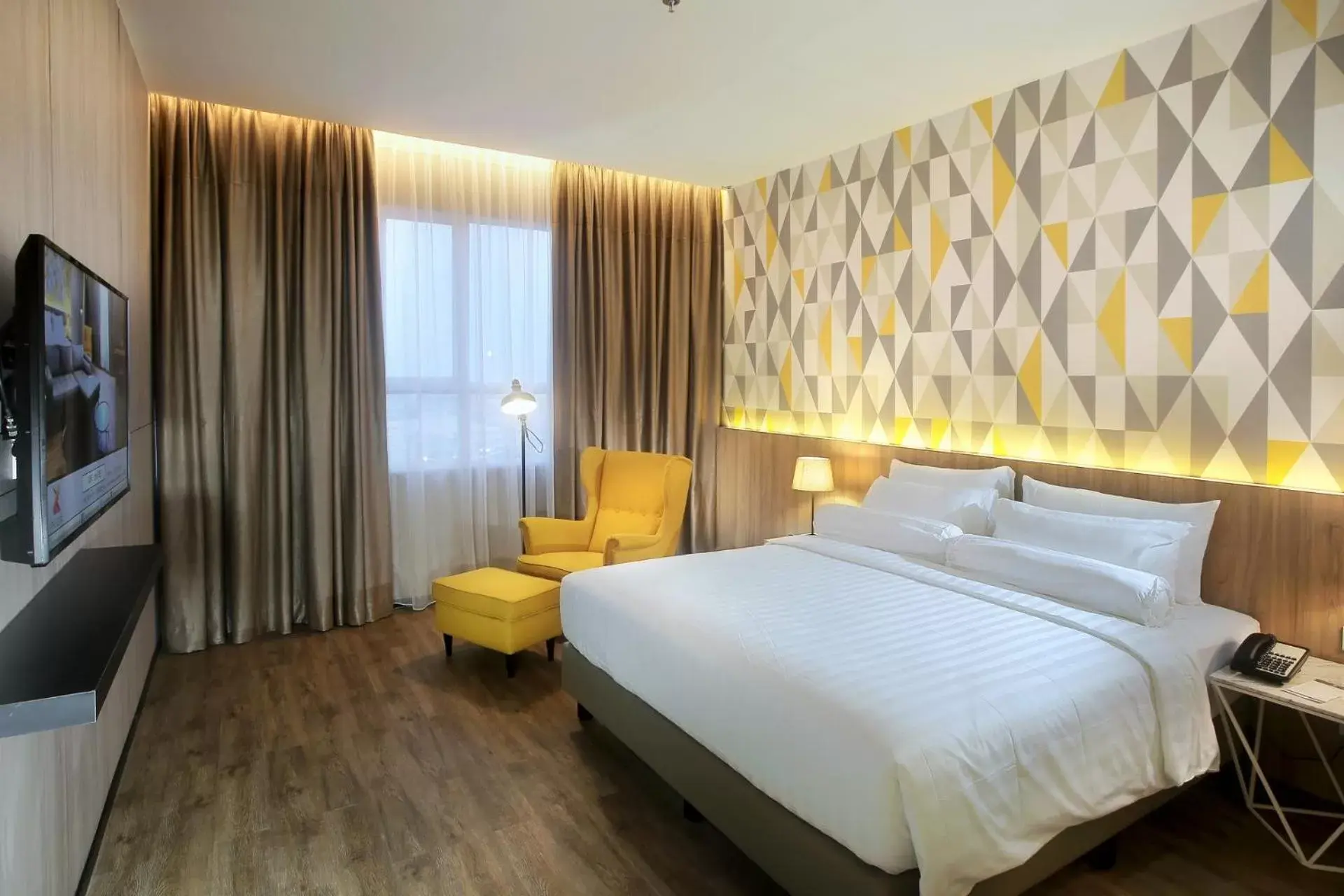 TV and multimedia, Bed in The Zuri Hotel Palembang