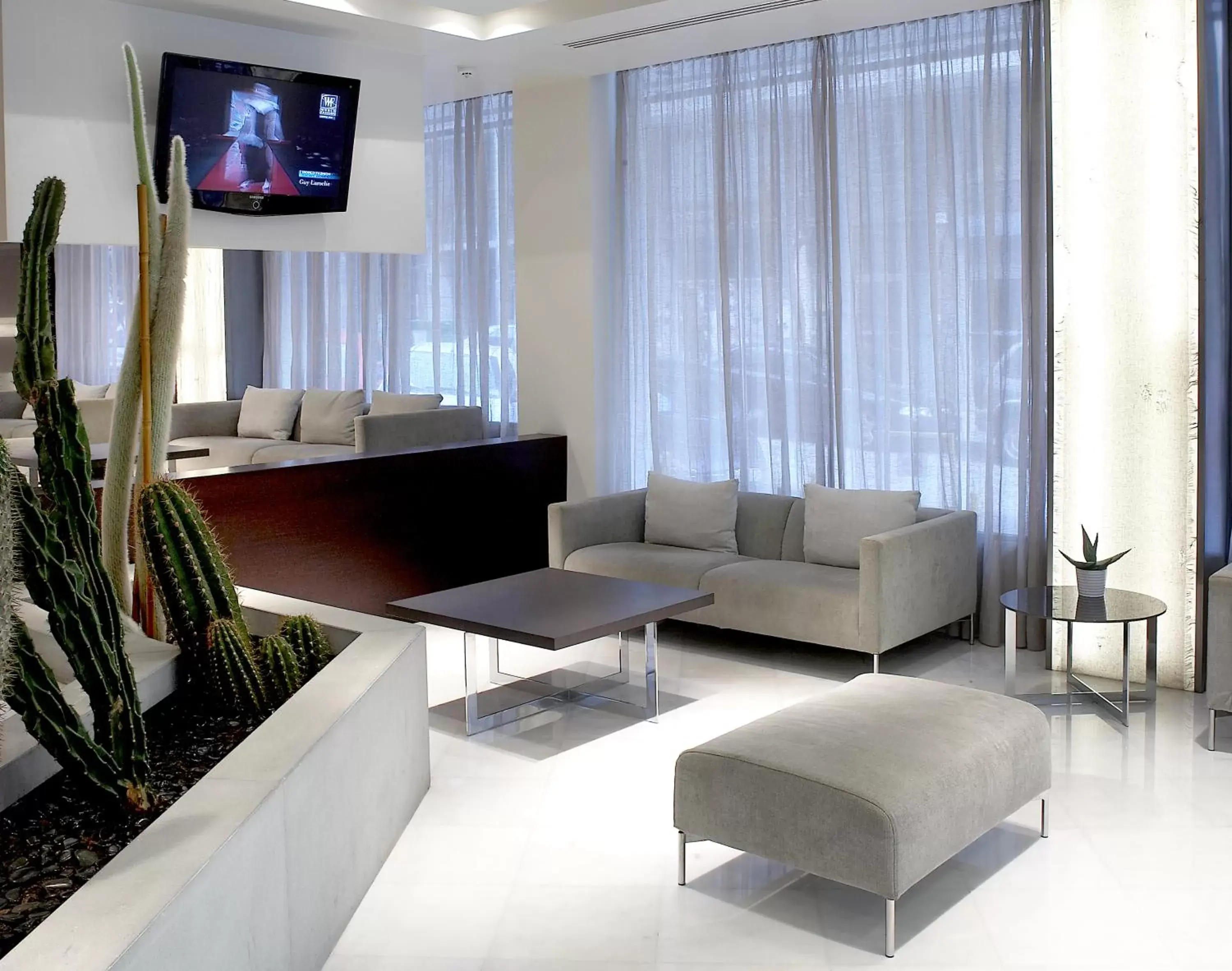 Lobby or reception, TV/Entertainment Center in Domotel Olympia
