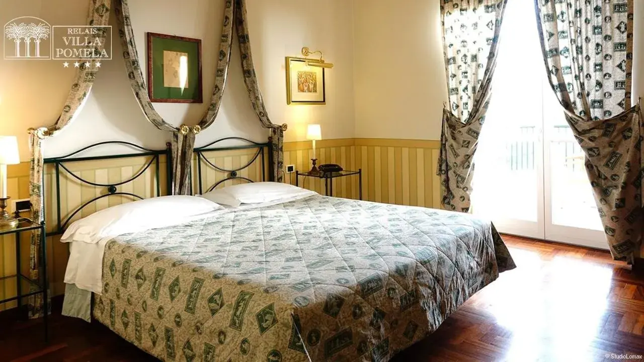 Bed in Relais Villa Pomela