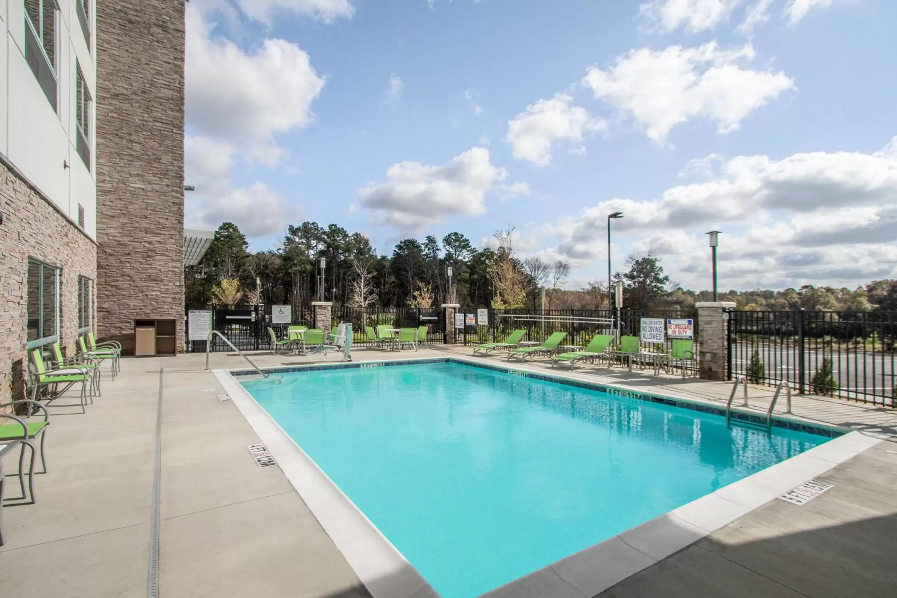 Swimming Pool in Holiday Inn Express & Suites Charlotte Southwest, an IHG Hotel