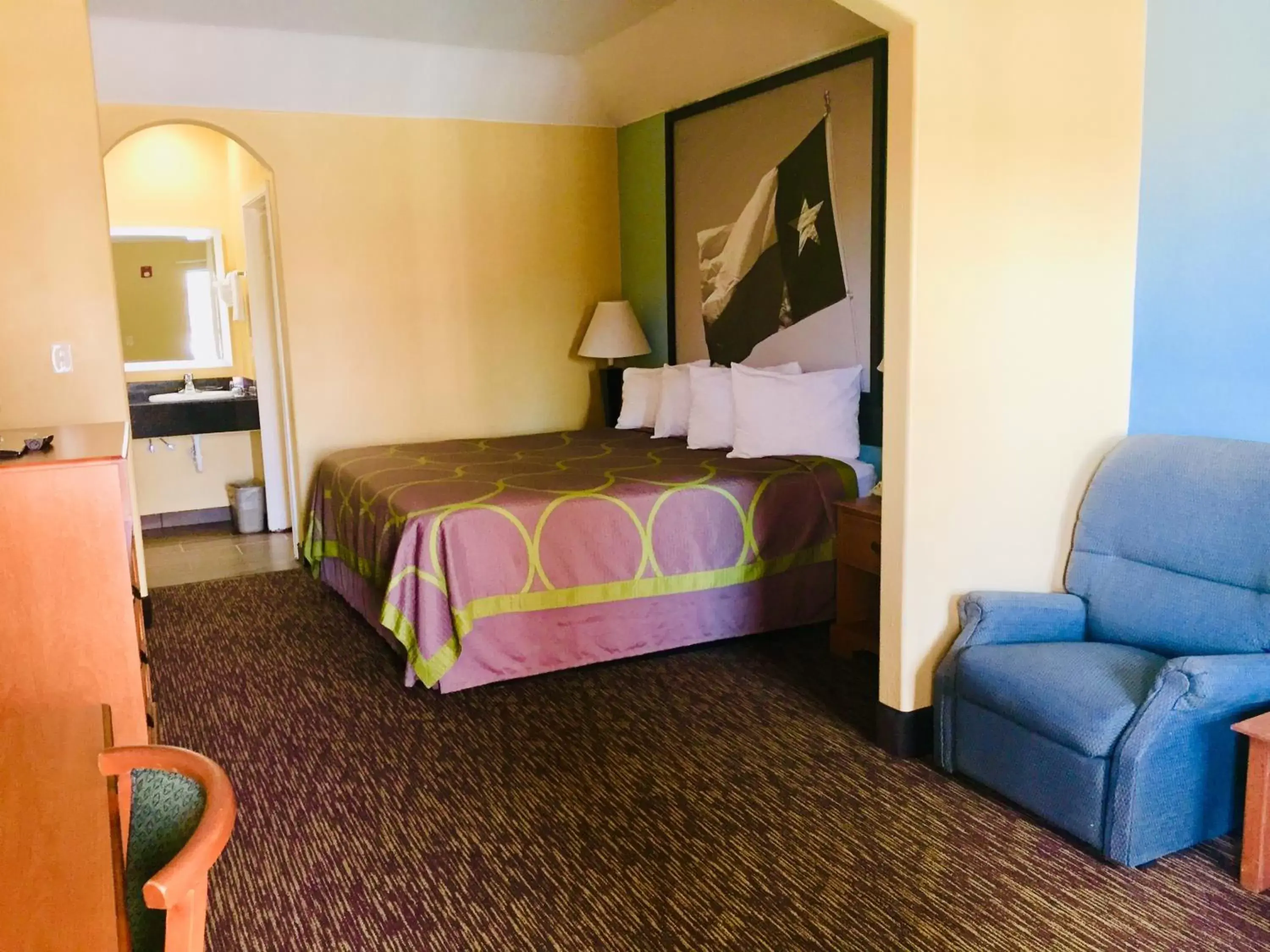 Bed in Super 8 by Wyndham Montgomery/ Lake Conroe