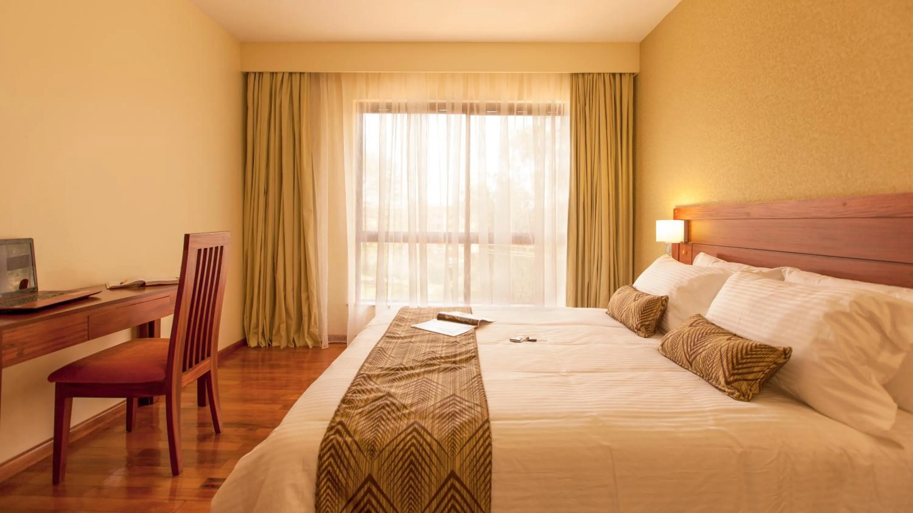 Bed in Waridi Paradise Hotel and Suites