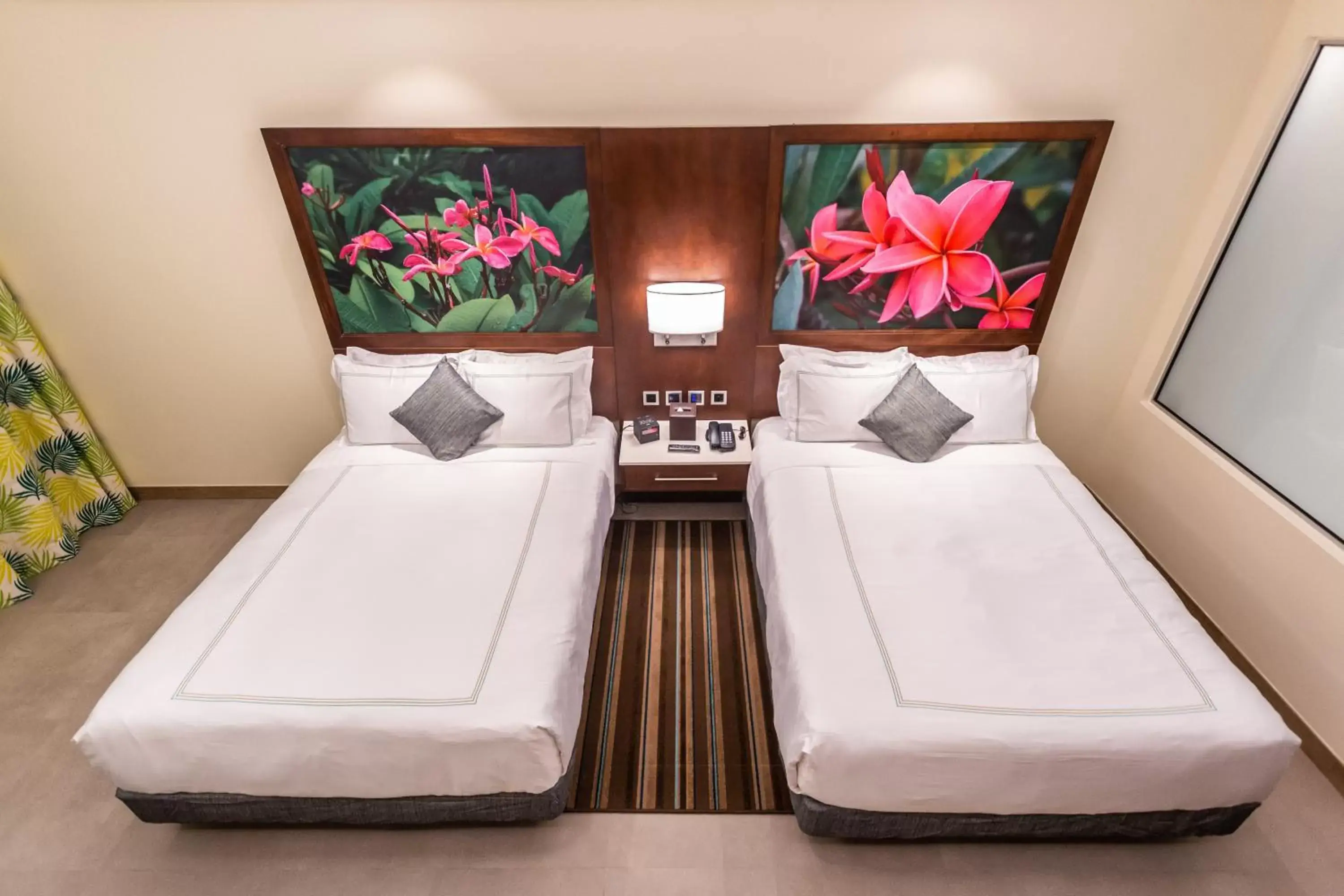 Bed in Surfrider Resort Hotel