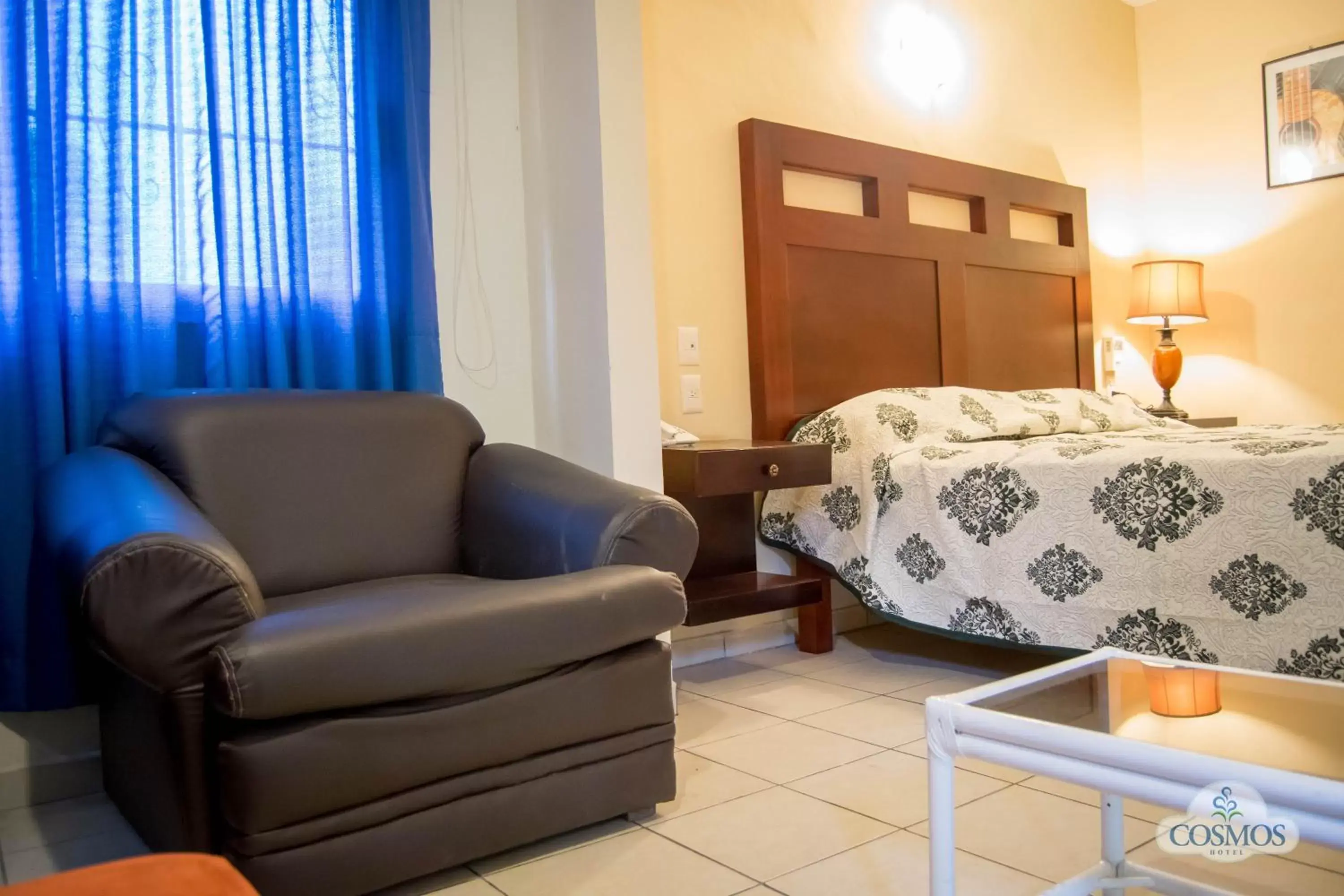 Bed, Seating Area in Hotel Cosmos