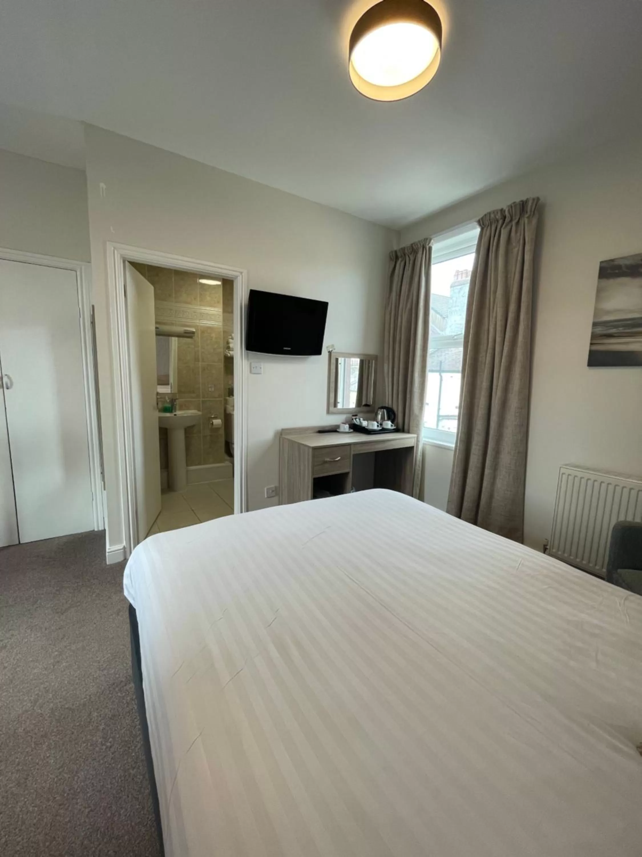 Bed in The Clarendon Hotel