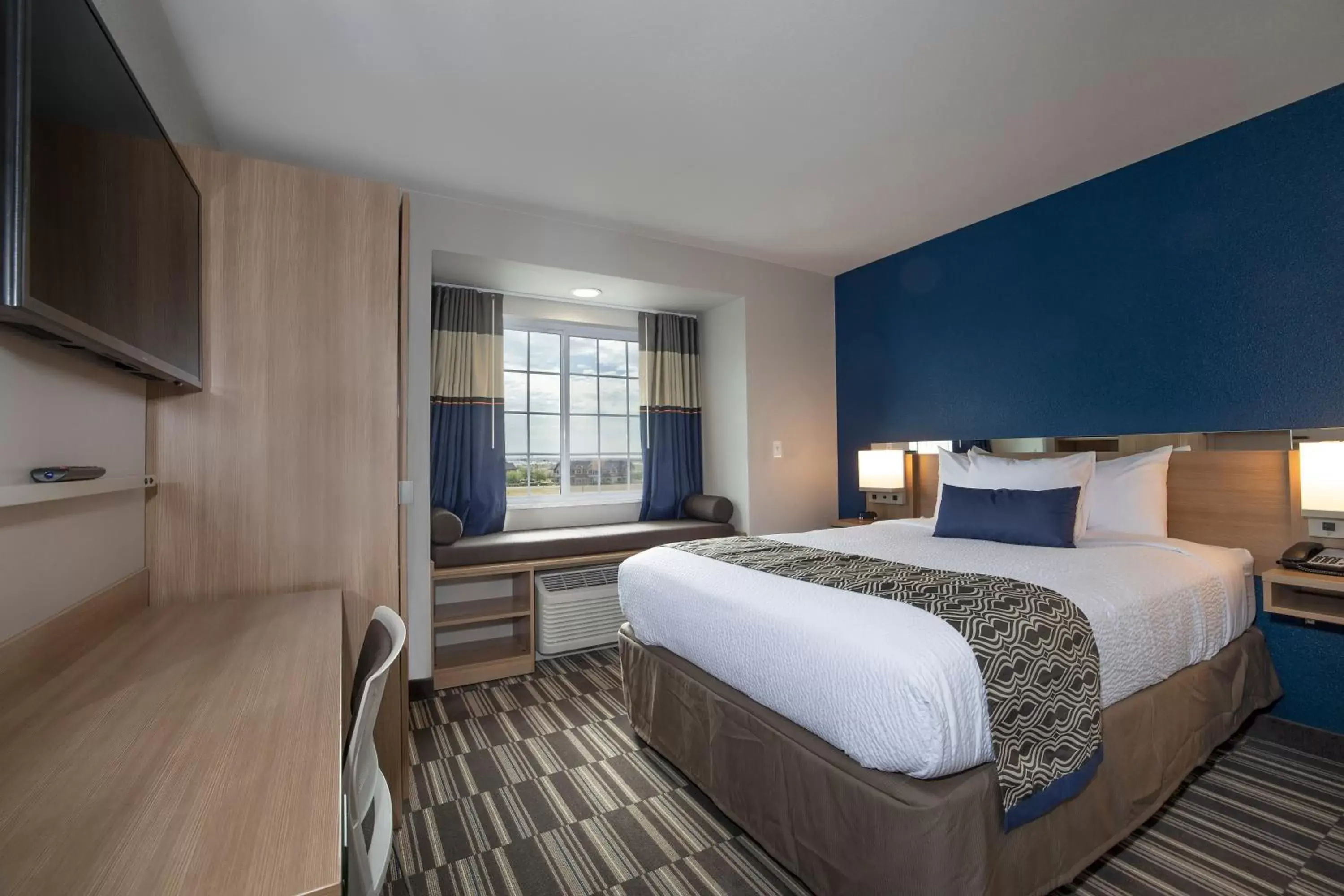 Bed in Microtel Inn & Suites by Wyndham Loveland