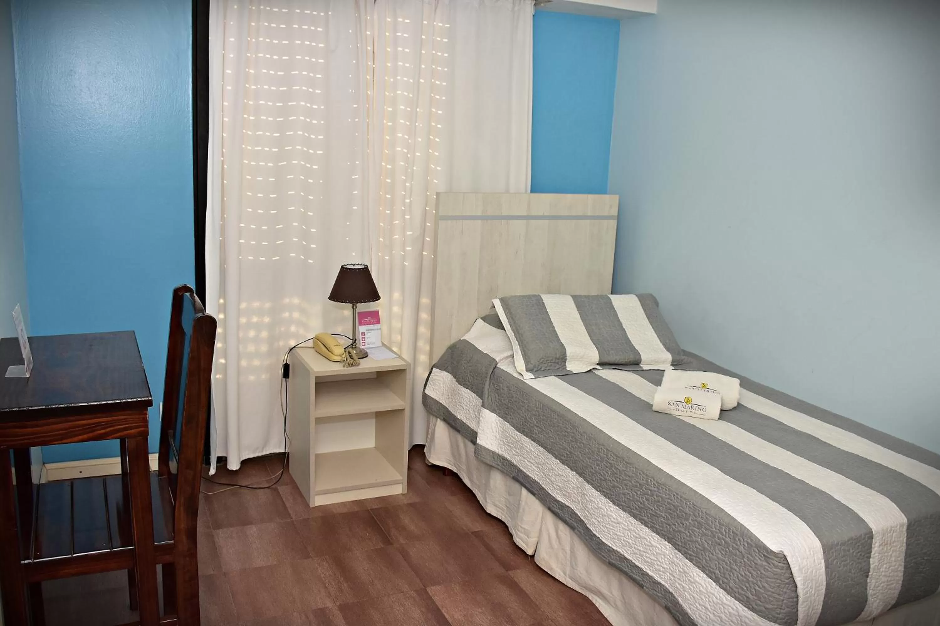 Bed in Hotel San Marino