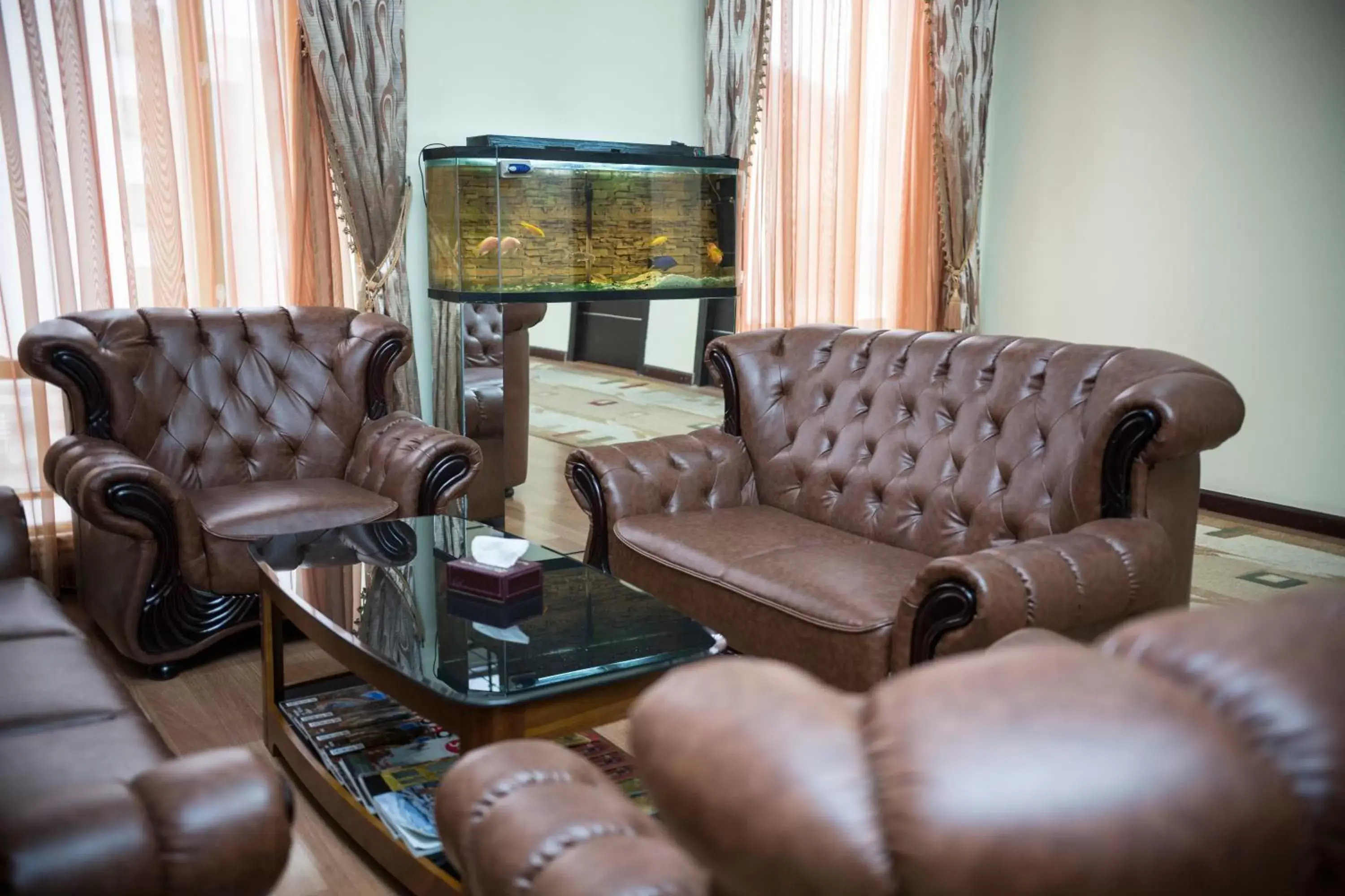 Communal lounge/ TV room, Seating Area in Capital Hotel