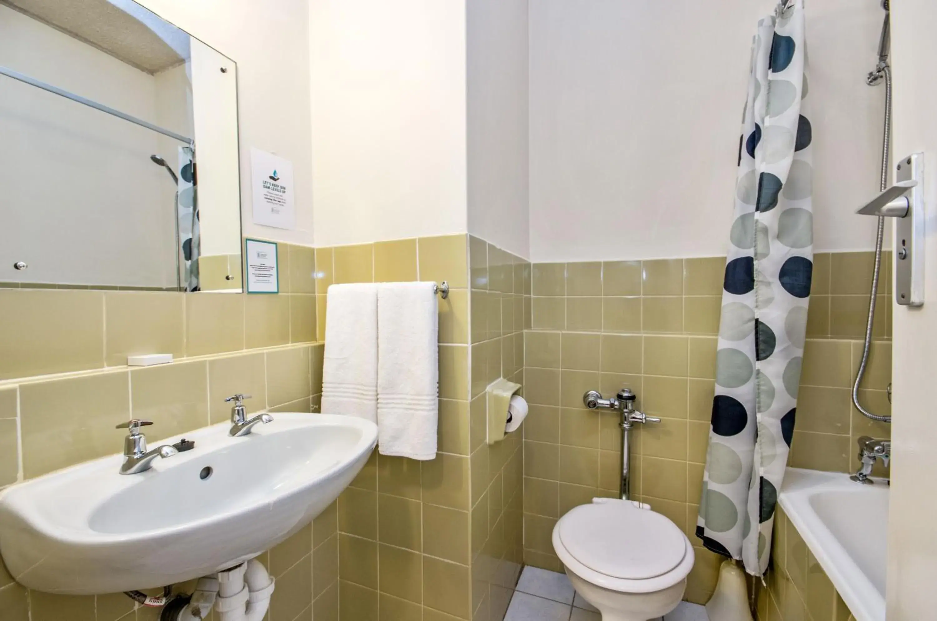 Bathroom in Gardens Centre Holiday Apartments