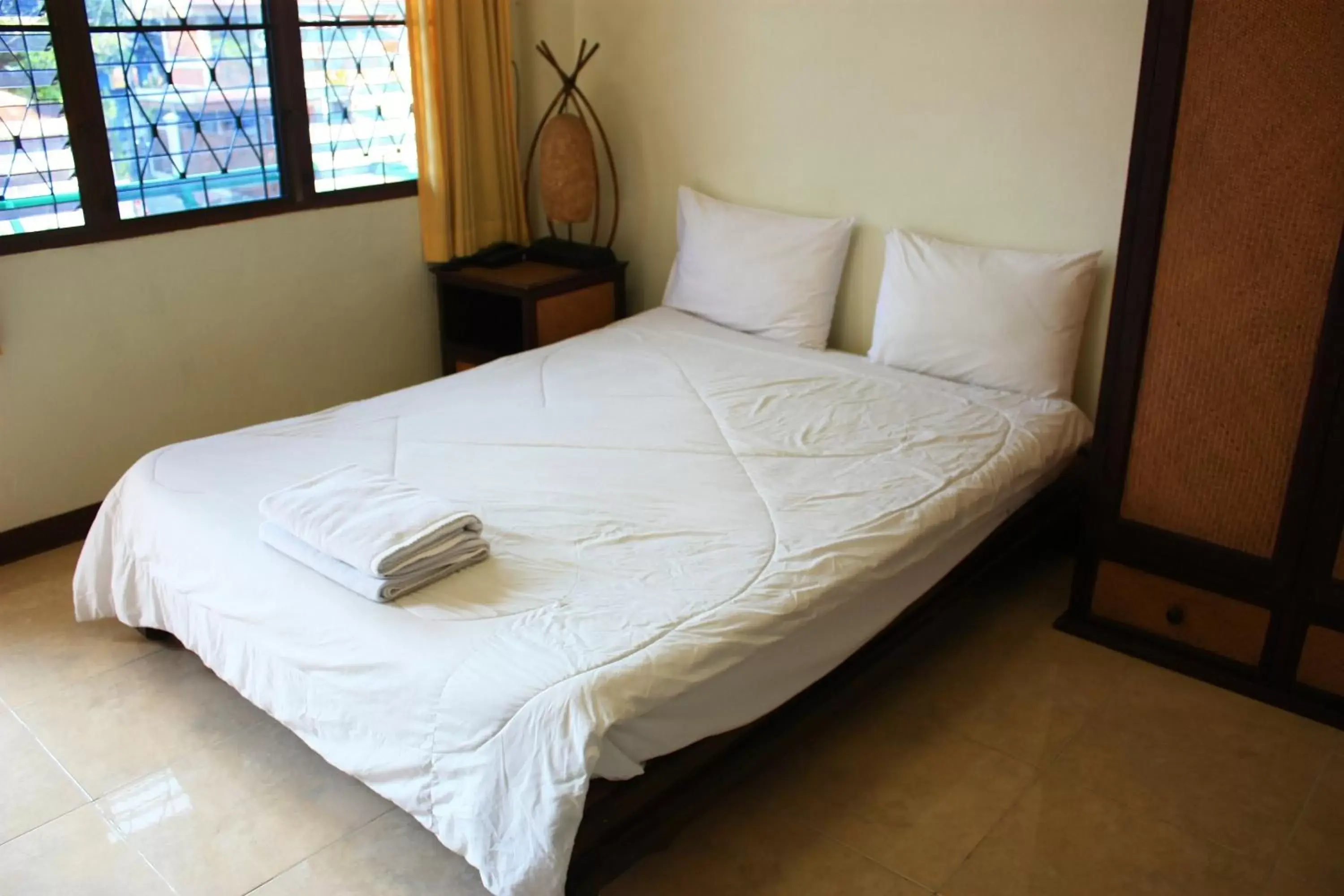 Bed in โรงแรมตีฆ้อง - Tri Gong Hotel Bed in โรงแรมตีฆ้อง - Tri Gong Hotel