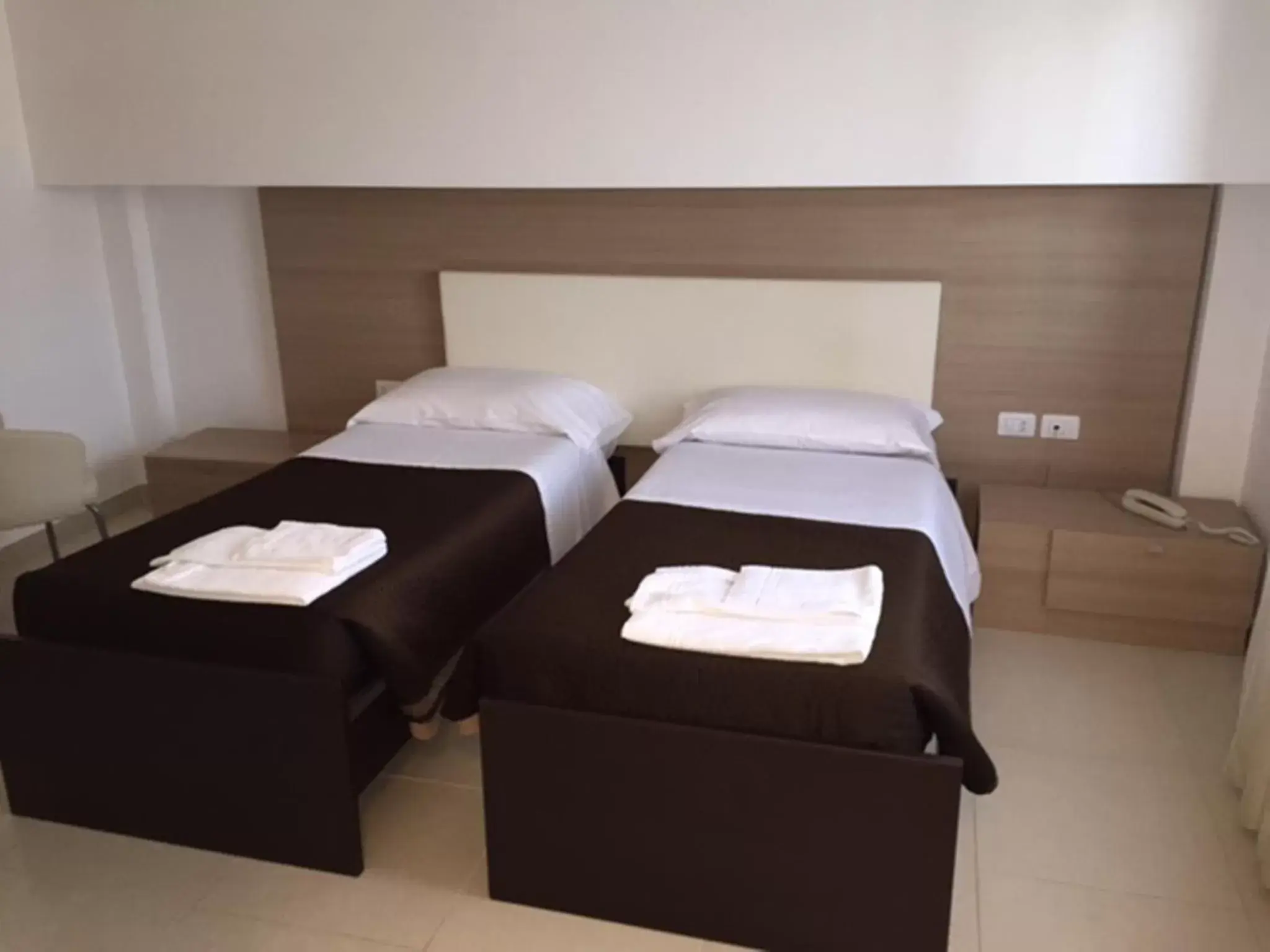 Bed in San Michele Apartments&Rooms