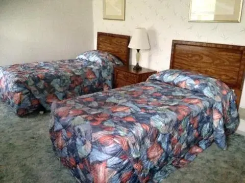 Bed in Eagle Village Resort & Chalet