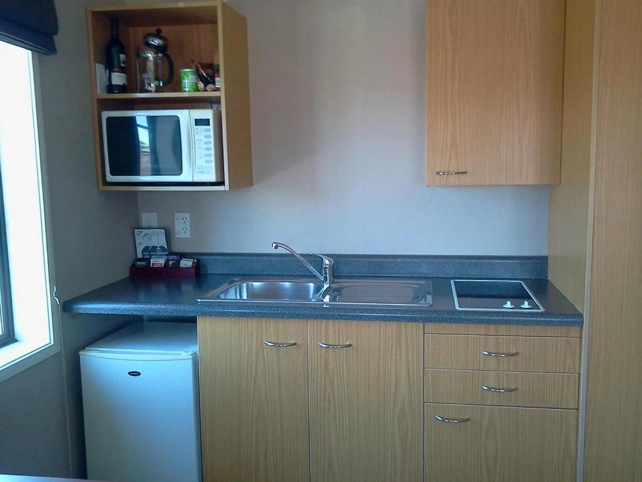 Kitchen or kitchenette in City Suites