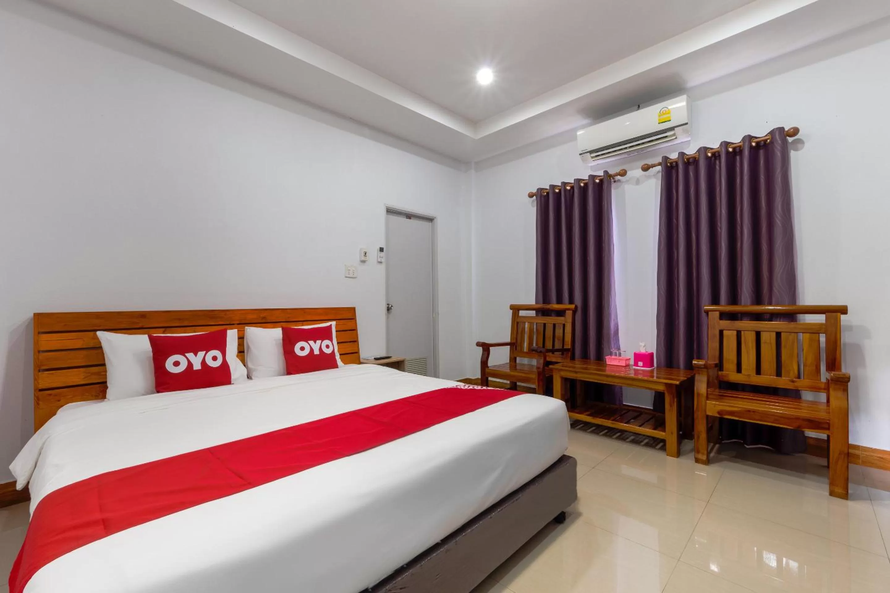 Bedroom in OYO 1044 Vassana Resort