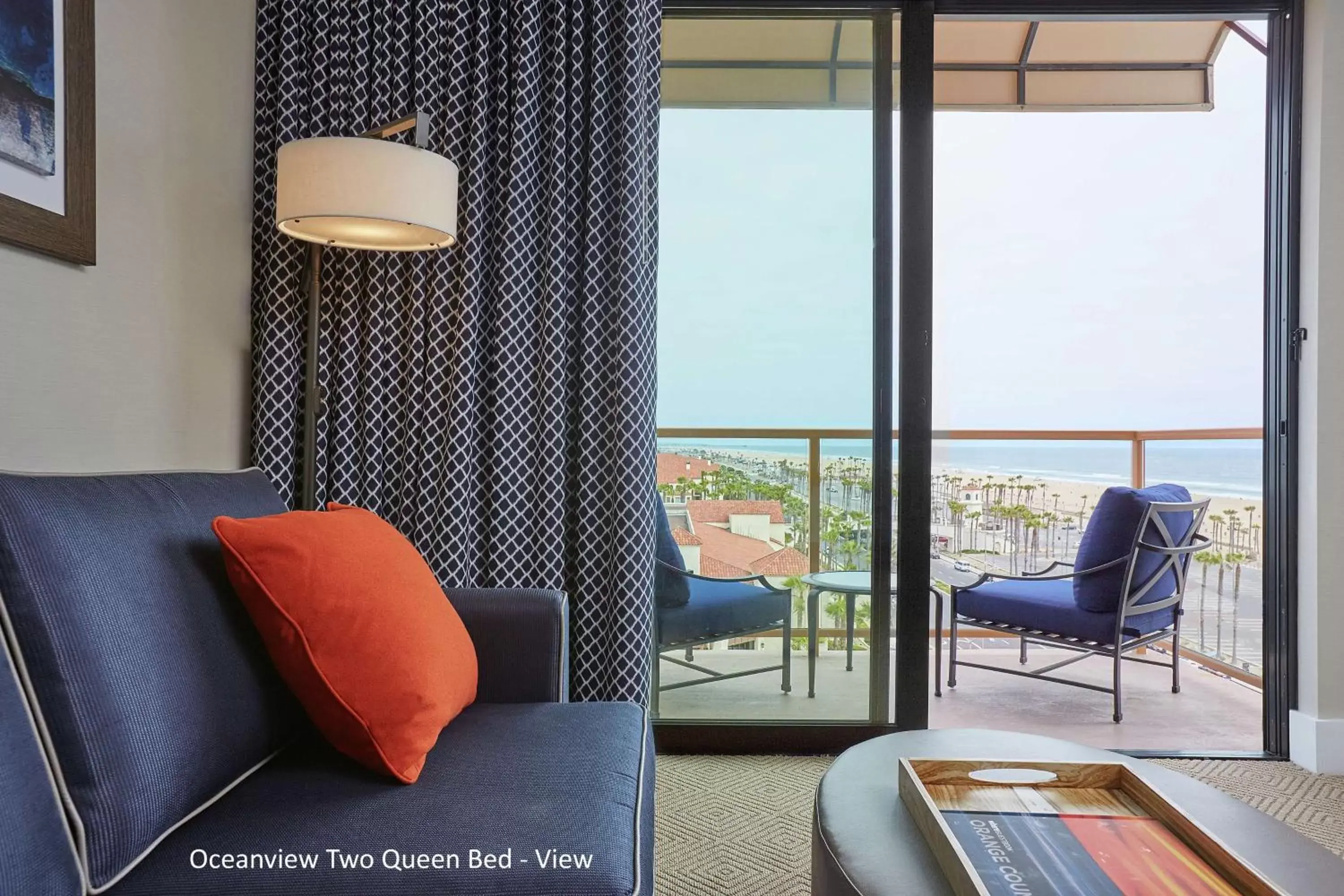 Living room, Seating Area in The Waterfront Beach Resort, A Hilton Hotel