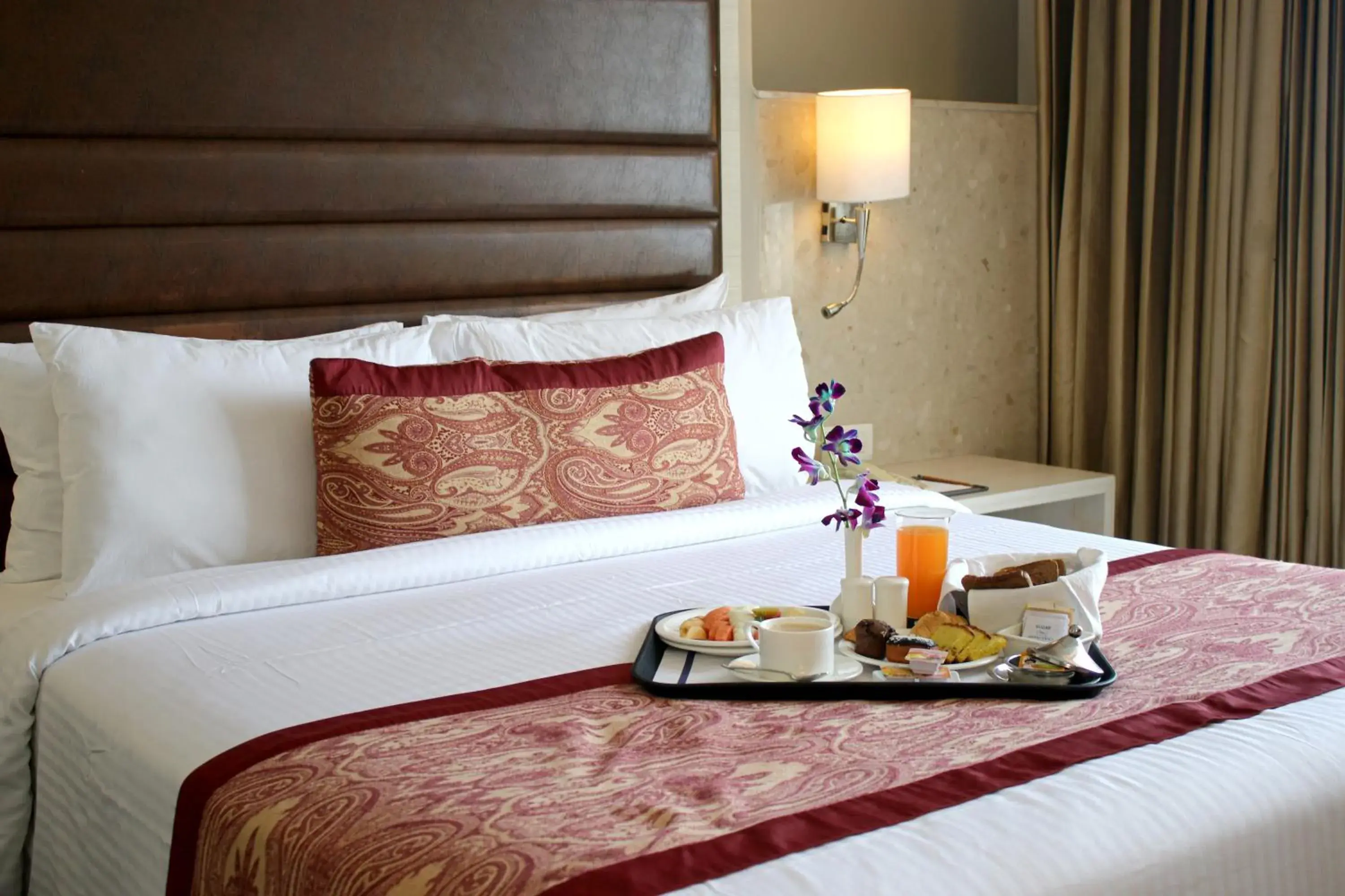 Bed in Mahagun Sarovar Portico Suites Ghaziabad