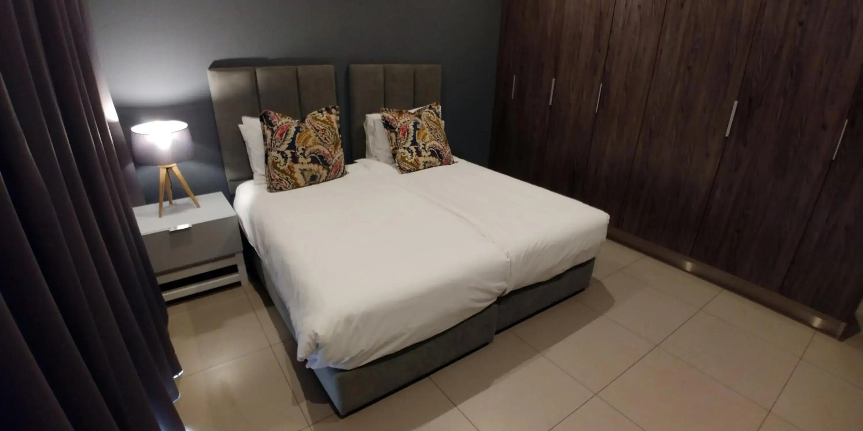 Bed in Odyssey Luxury Apartments