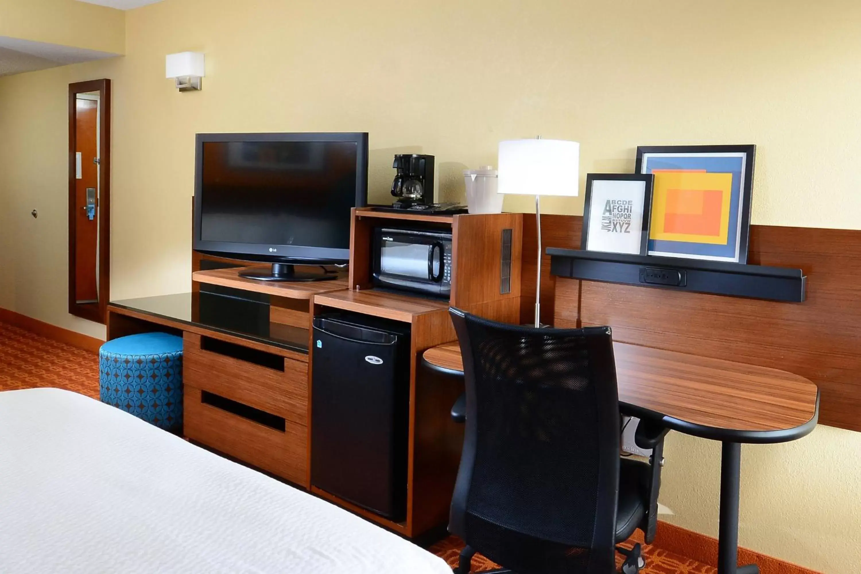 Photo of the whole room, TV/Entertainment Center in Fairfield Inn and Suites by Marriott Winston Salem/Hanes