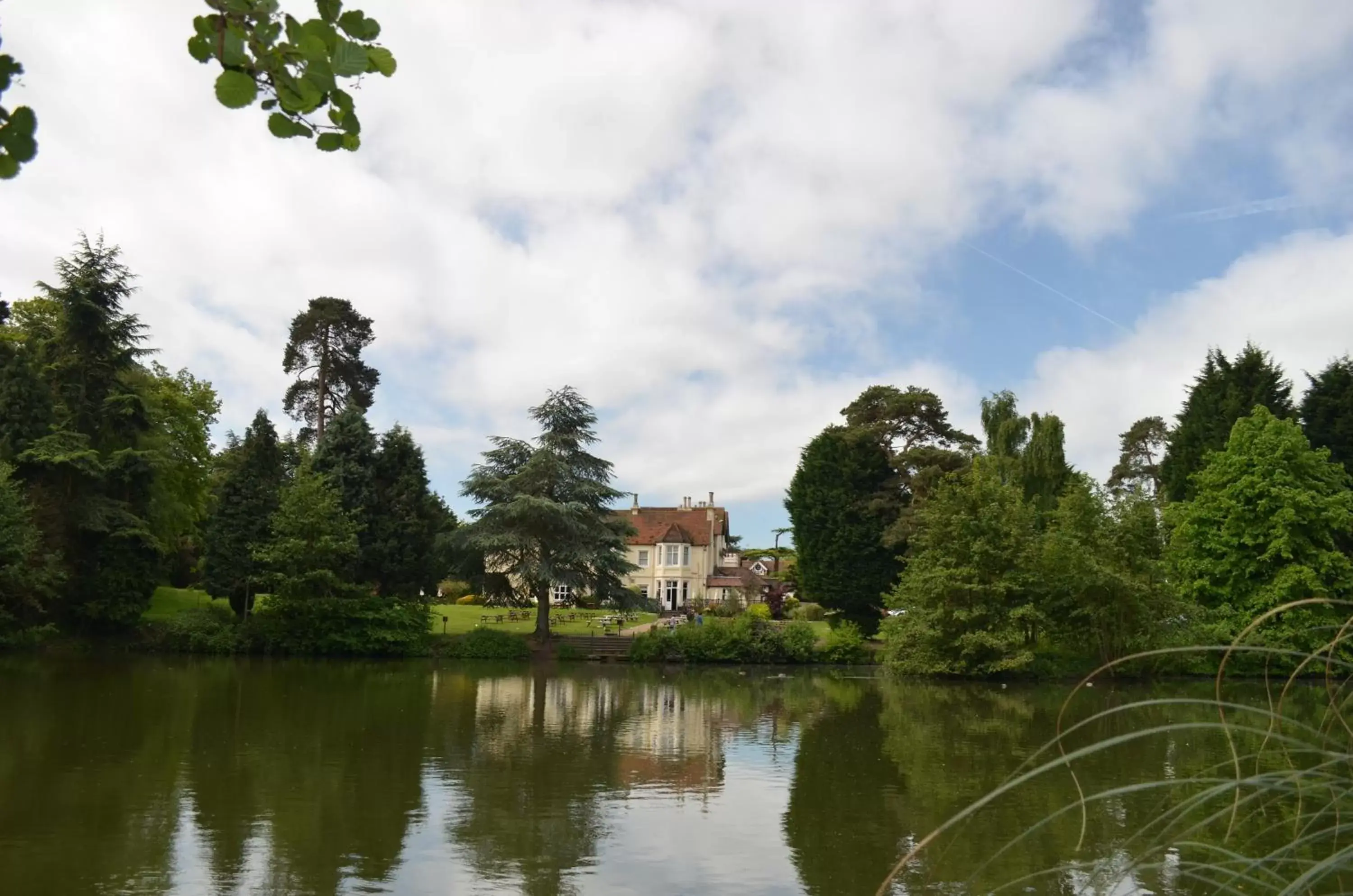 Property building in Worplesdon Place Hotel