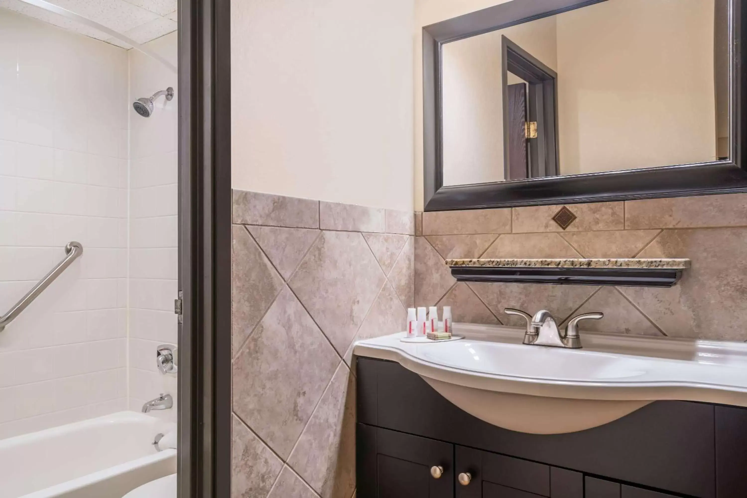 Bathroom in Ramada by Wyndham Minneapolis Golden Valley