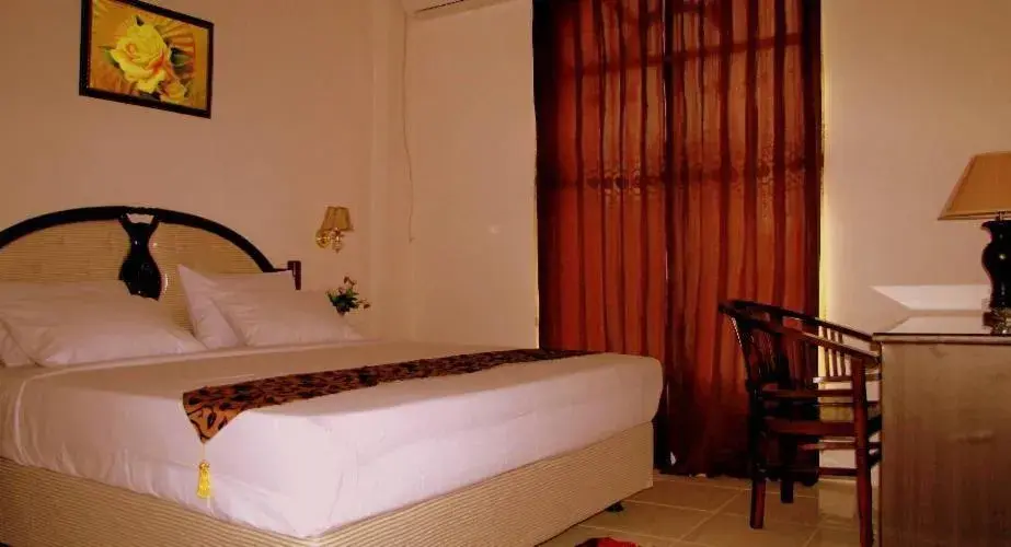 Bed in Hotel Mitra Garden