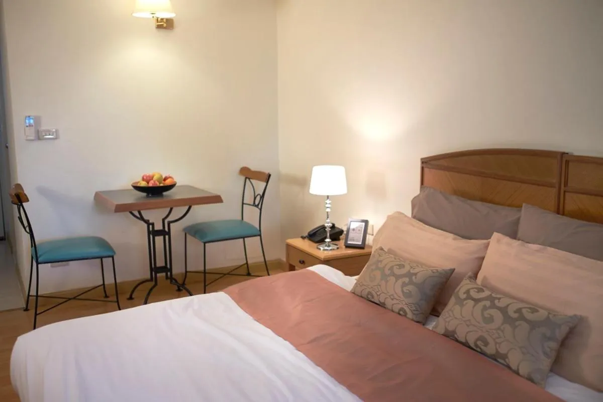 Photo of the whole room, Bed in Ravipha Residences