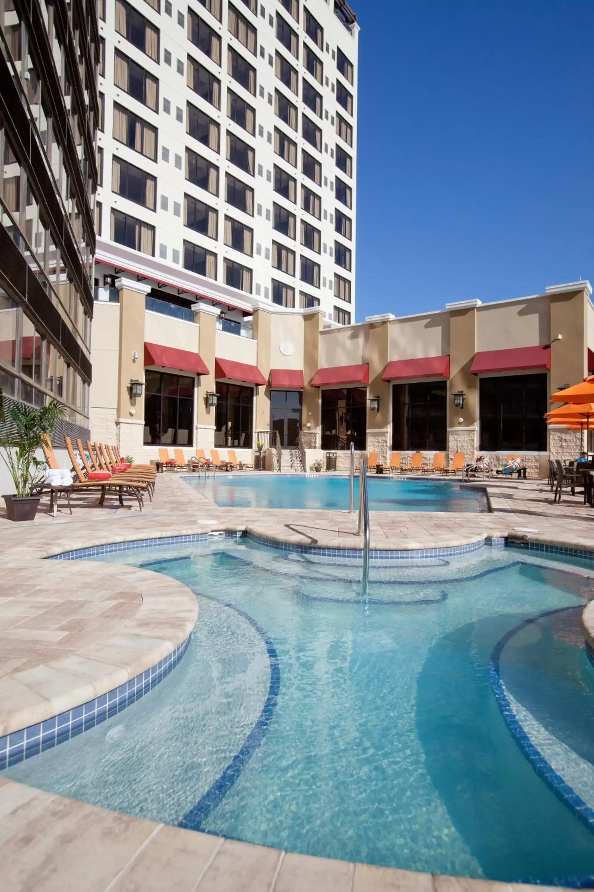 Property building, Swimming Pool in Ramada Suites By Wyndham Orlando International Drive