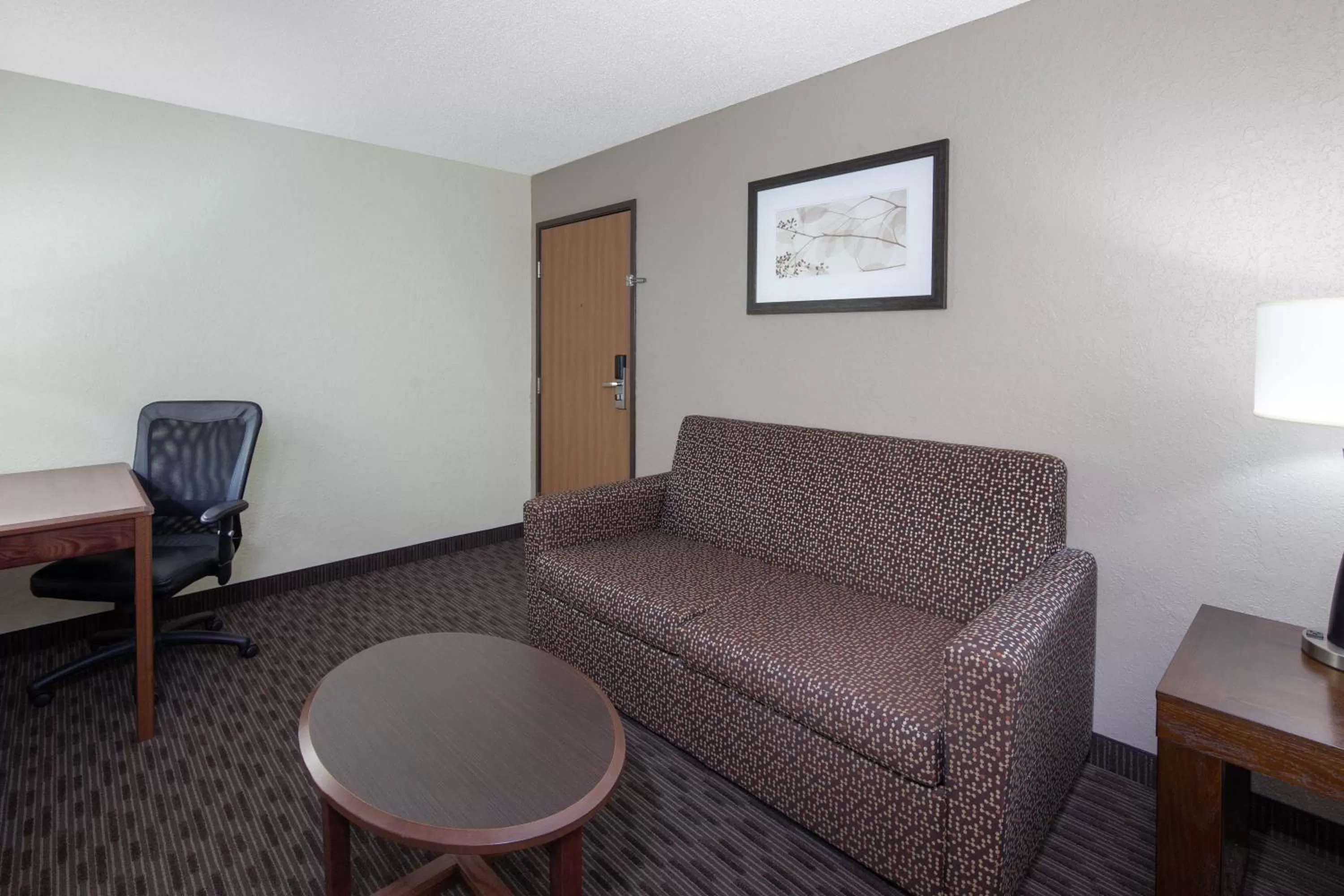 Living room in AmericInn by Wyndham Ironwood