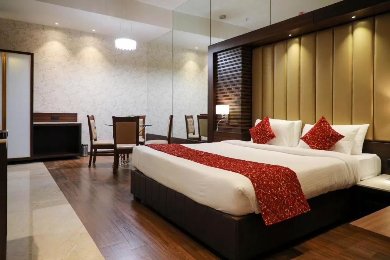 Bed in Hotel Gurudev Grand