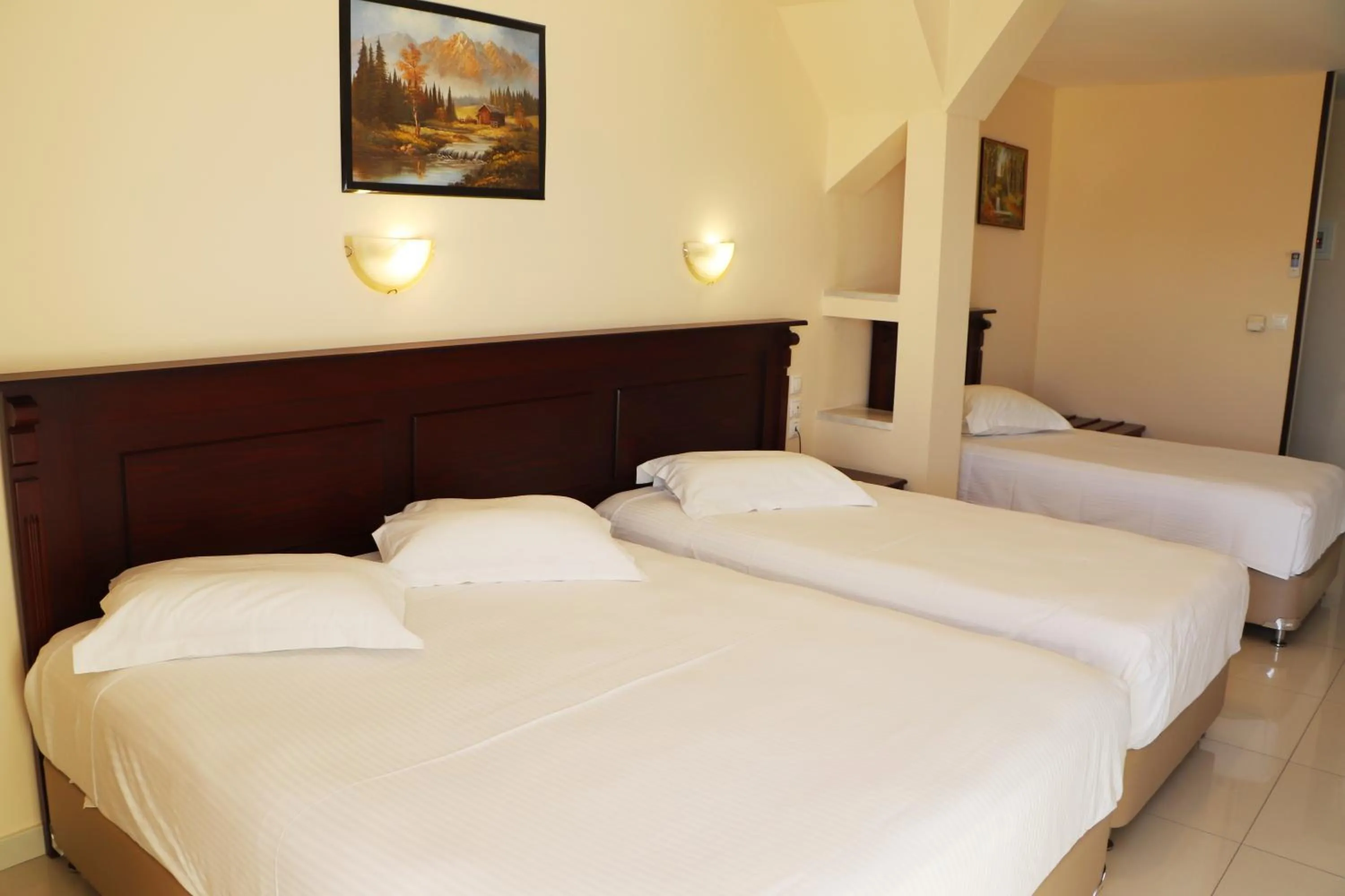 Bed in Hotel Kosta Famissi