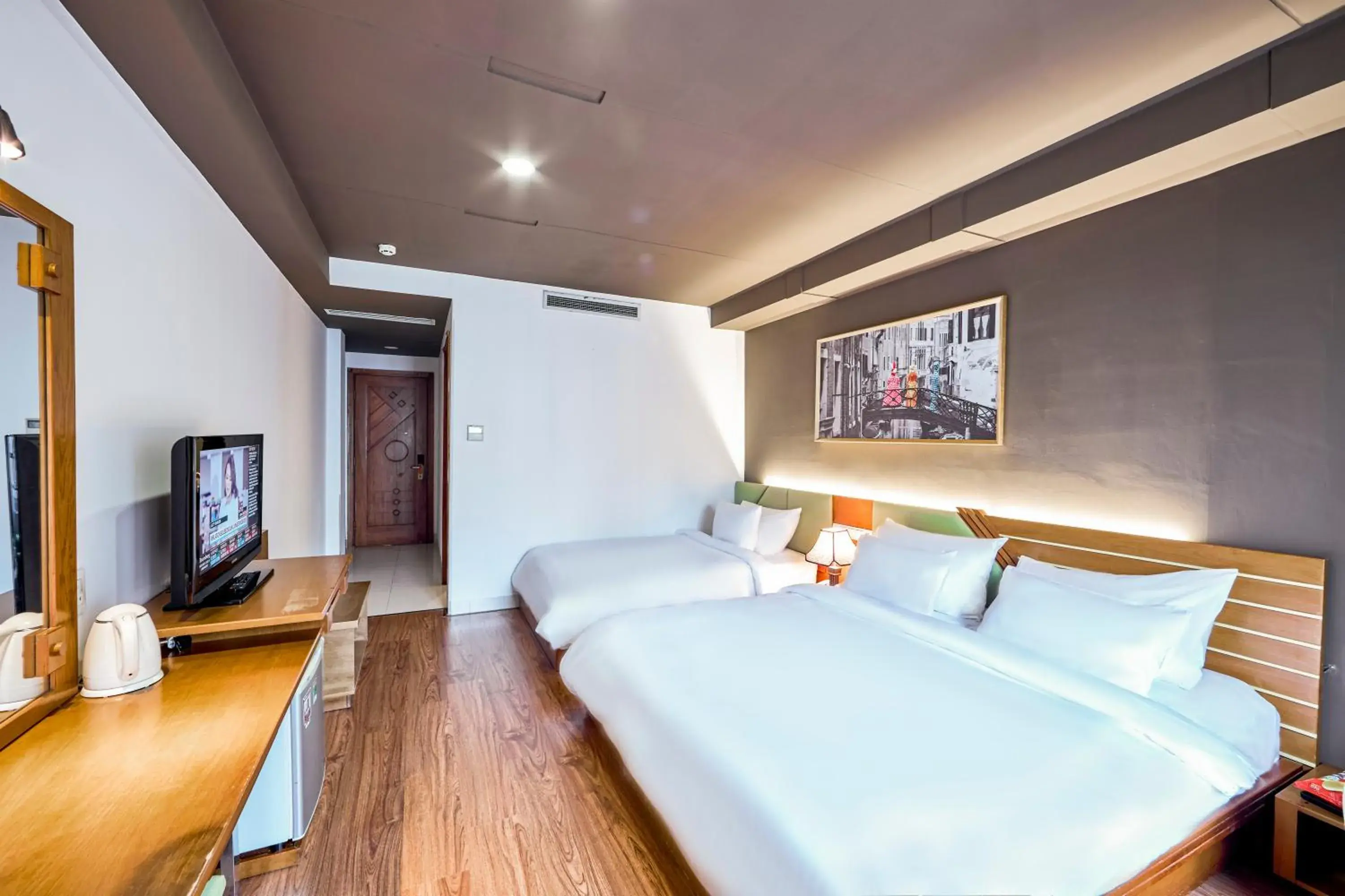 Bedroom in The Noble Swan Hotel Saigon