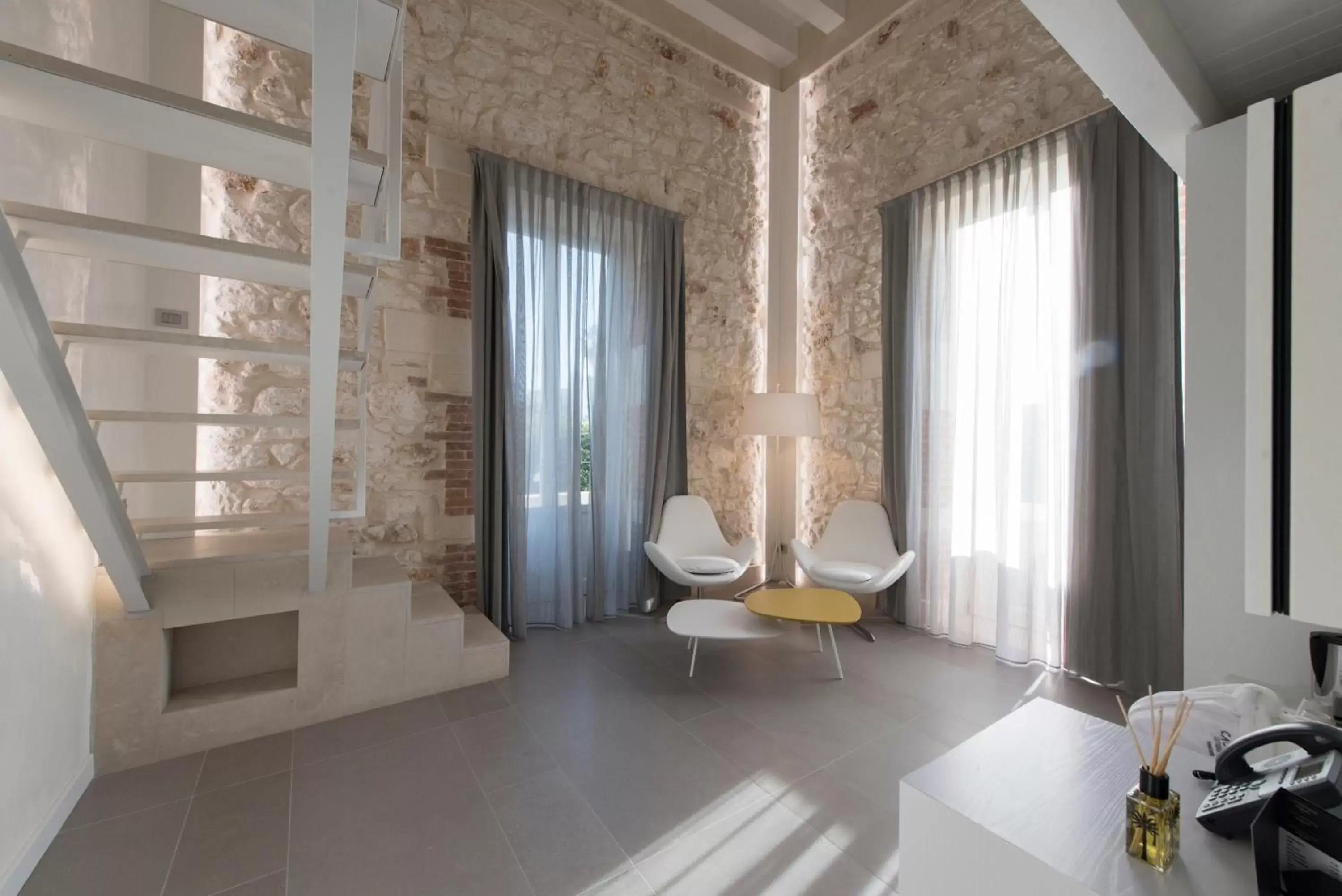 Bed, Seating Area in Caportigia Boutique Hotel