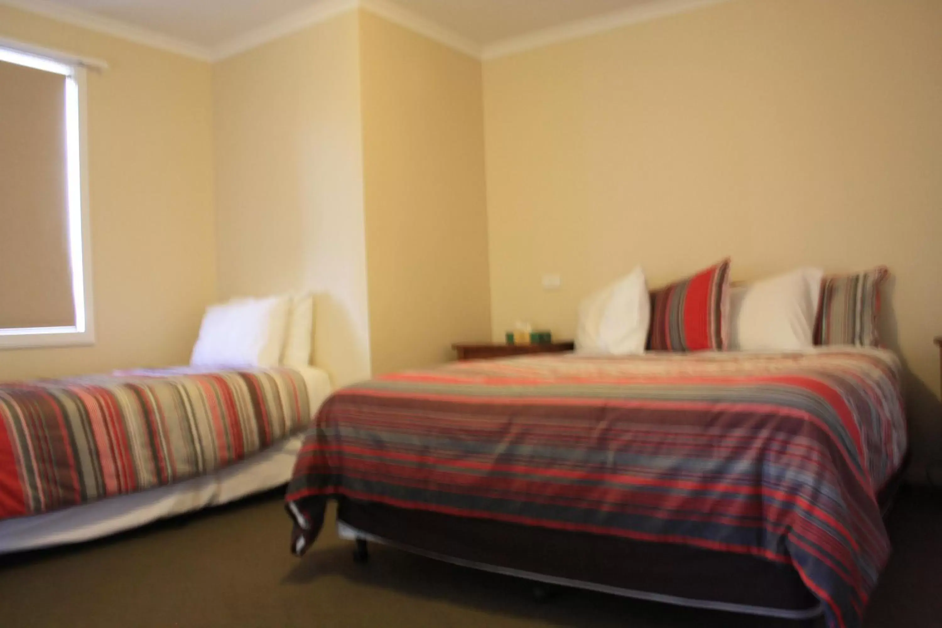 Bedroom, Bed in Grand Manor Motor Inn